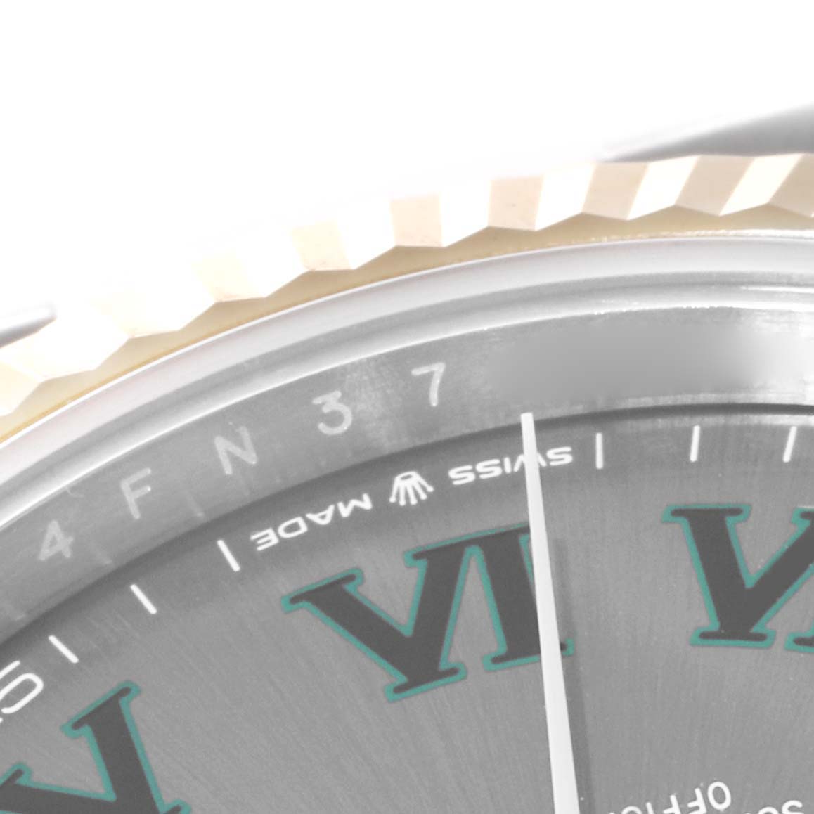 The image shows a close-up of the bezel and partial dial of the Rolex Datejust 41 126333 Men's Steel and Gold (two tone) Grey Dial 126333 Men's Steel and Gold (two tone) Grey Dial, focusing on the "Swiss Made" text and Roman numeral markers.