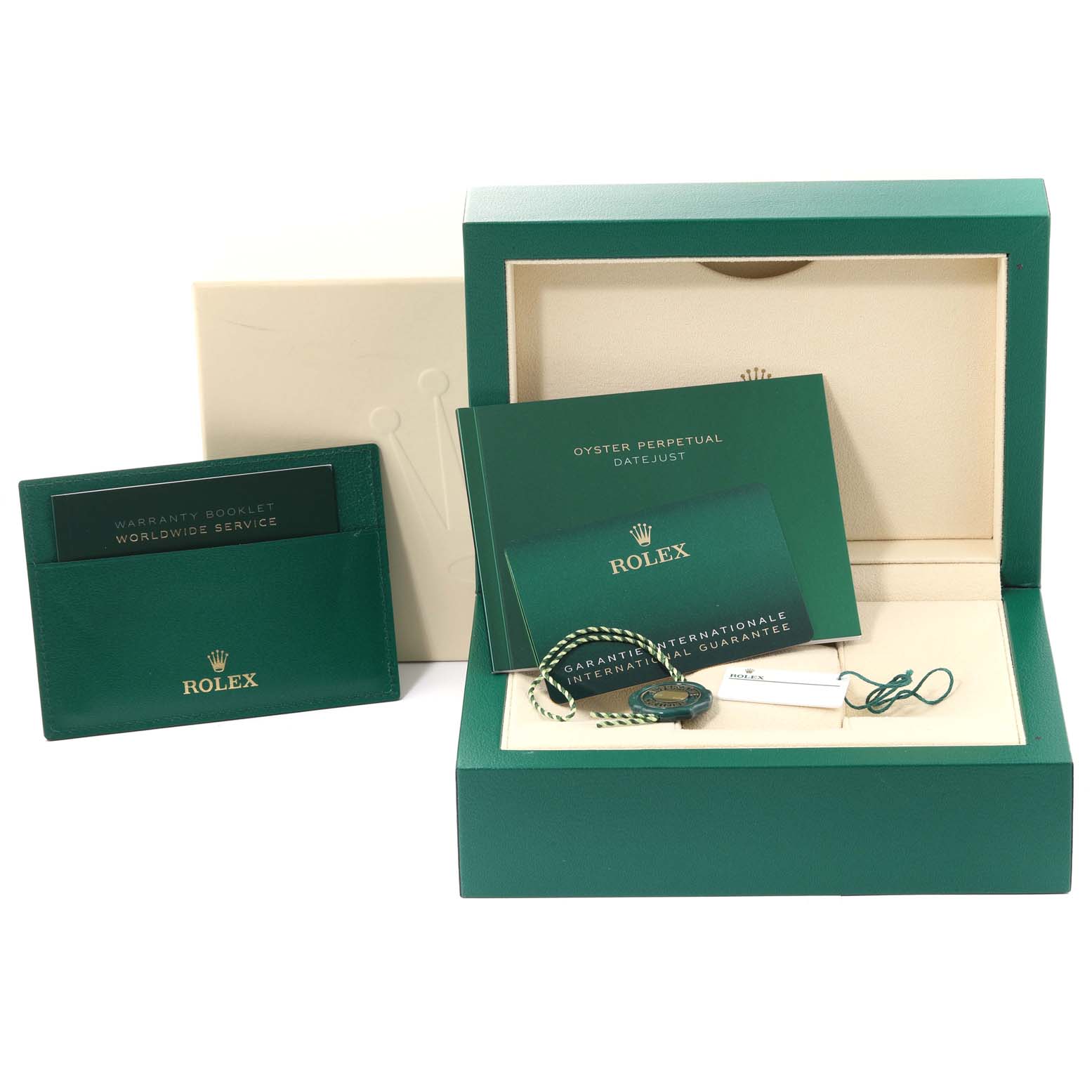 The image shows the accessories of a Rolex Datejust 41 126333 Men's Steel and Gold (two tone) Grey Dial 126333 Men's Steel and Gold (two tone) Grey Dial model, including the presentation box, warranty booklet, and international guarantee card.