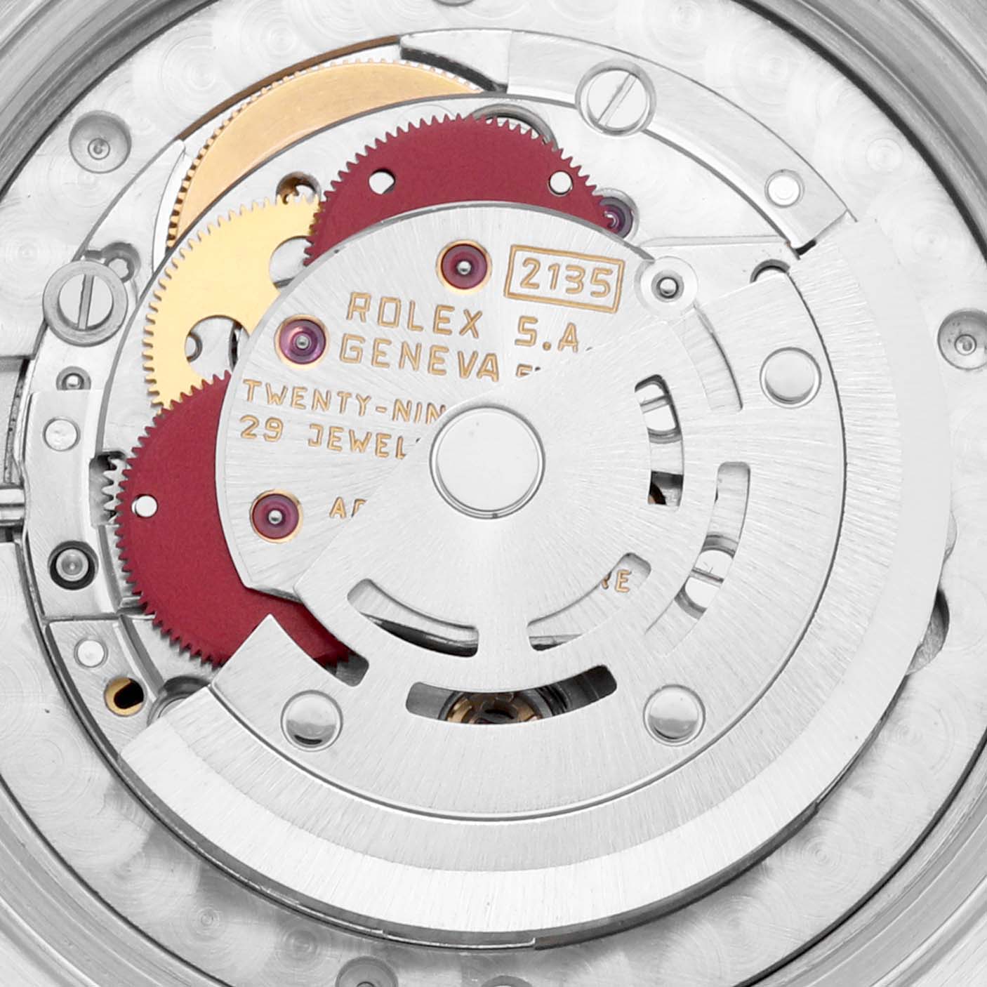This image shows the internal mechanism of a Mid-Size Rolex watch, focusing on the intricate gears and movement parts.