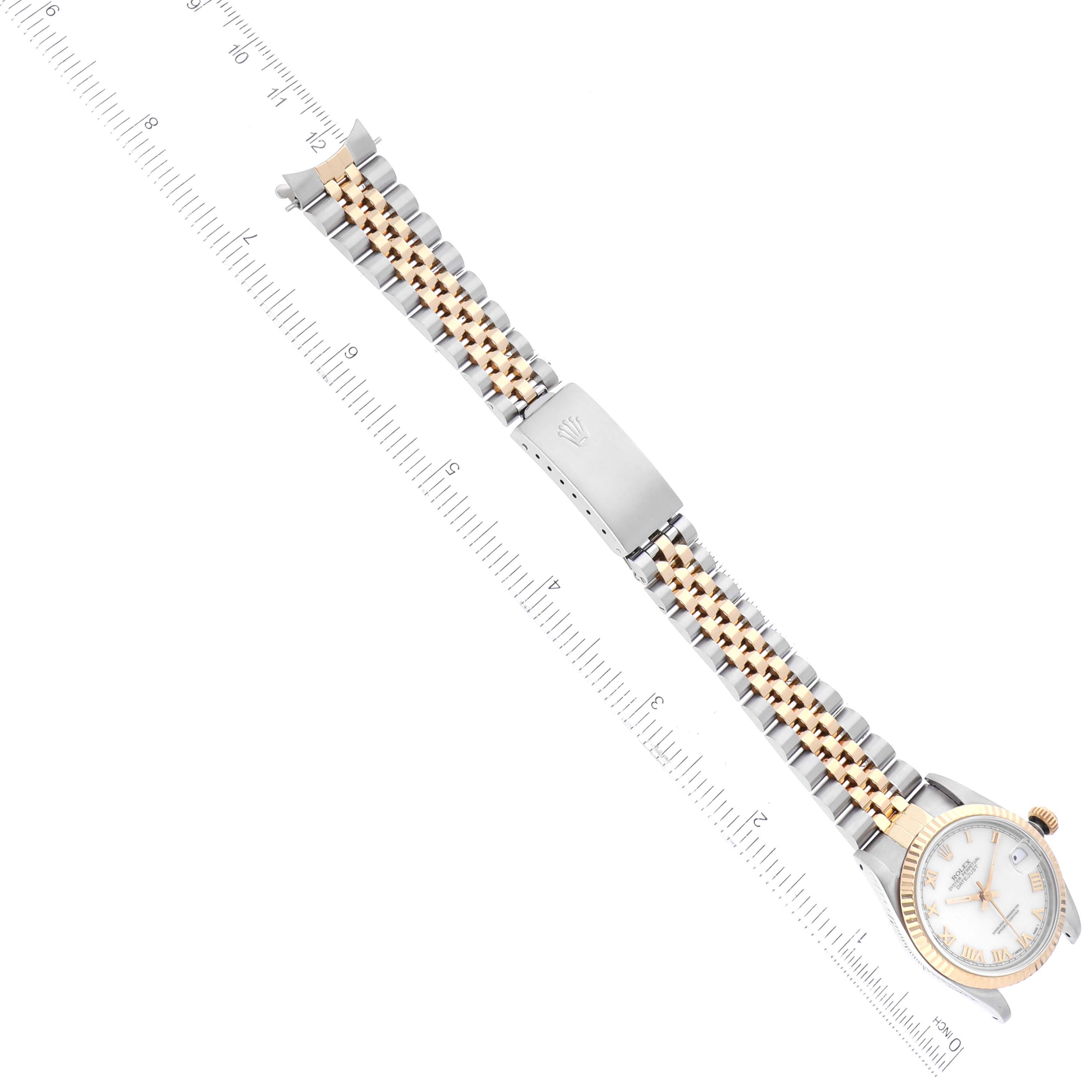 The image shows a Rolex Mid-Size 68273 Women's Steel and Gold (two tone) White Dial 68273 Women's Steel and Gold (two tone) White Dial model watch laid flat, displaying both the dial and the bracelet alongside a ruler for scale.