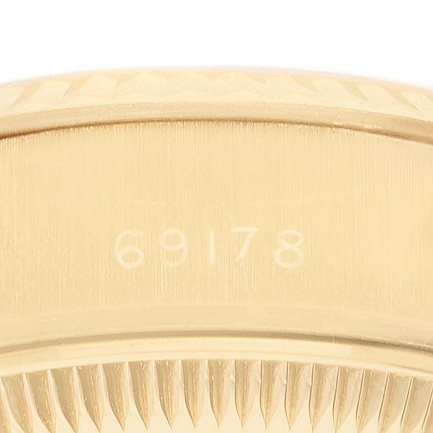 This close-up shot of a Rolex President 69178 Women
s Yellow Gold Champagne Dial 69178 Women
s Yellow Gold Champagne Dial watch shows the model number "69178" on its gold case and bezel.