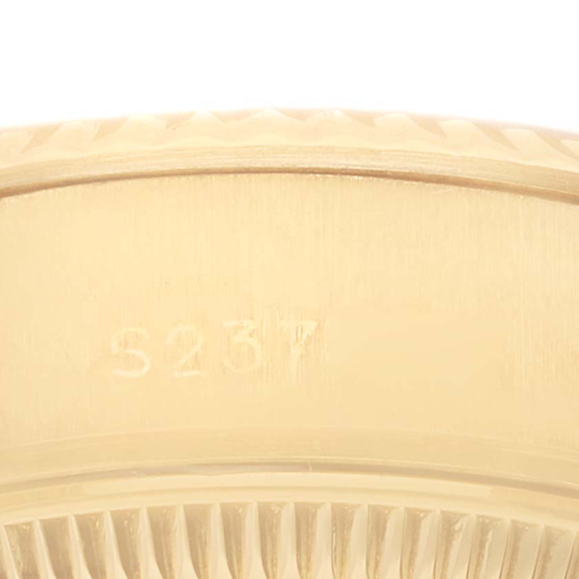 This image shows a close-up of the side profile of a Rolex President 69178 Women
s Yellow Gold Champagne Dial 69178 Women
s Yellow Gold Champagne Dial model watch, highlighting its serial number.