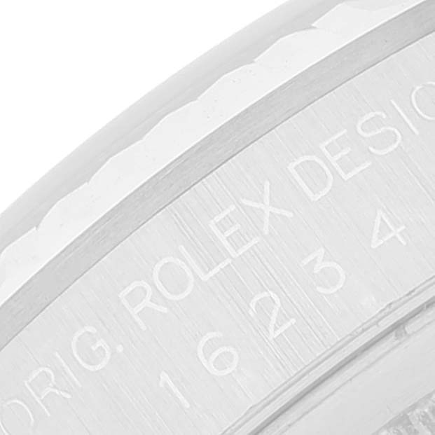 This close-up image shows the engraved inner rim of the bezel of a Rolex Datejust 16234 Men's Stainless Steel Silver Dial 16234 Men's Stainless Steel Silver Dial watch.
