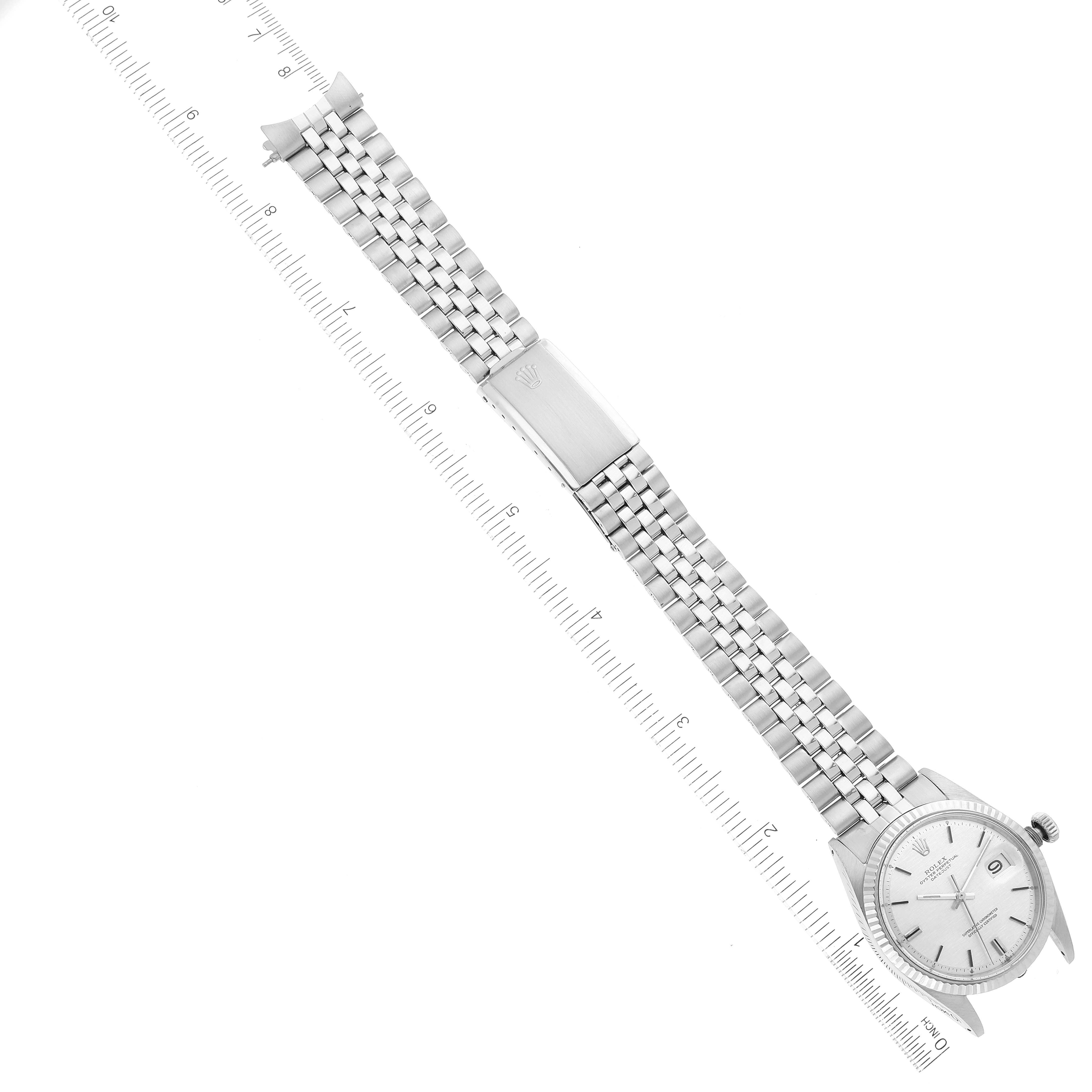 The image shows a top view of a Vintage Collection Rolex watch with its bracelet fully extended alongside a ruler.