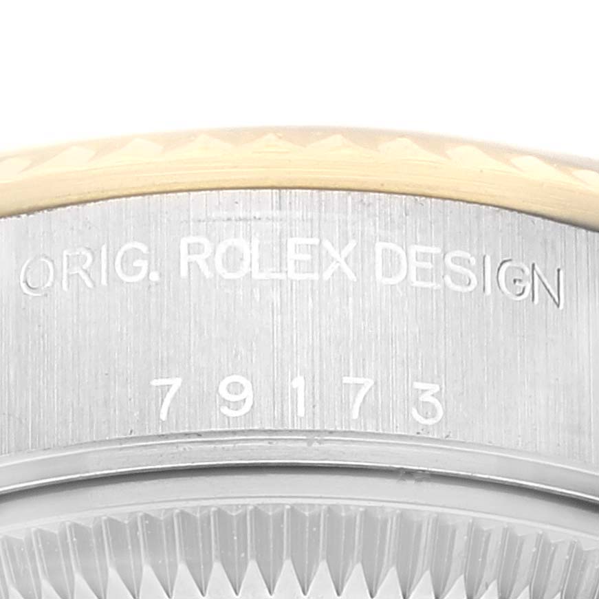 The image shows a close-up of the case side of a Rolex Datejust 79173 Women's Steel and Gold (two tone) Black Dial 79173 Women's Steel and Gold (two tone) Black Dial model, highlighting the engraved design number "79173".