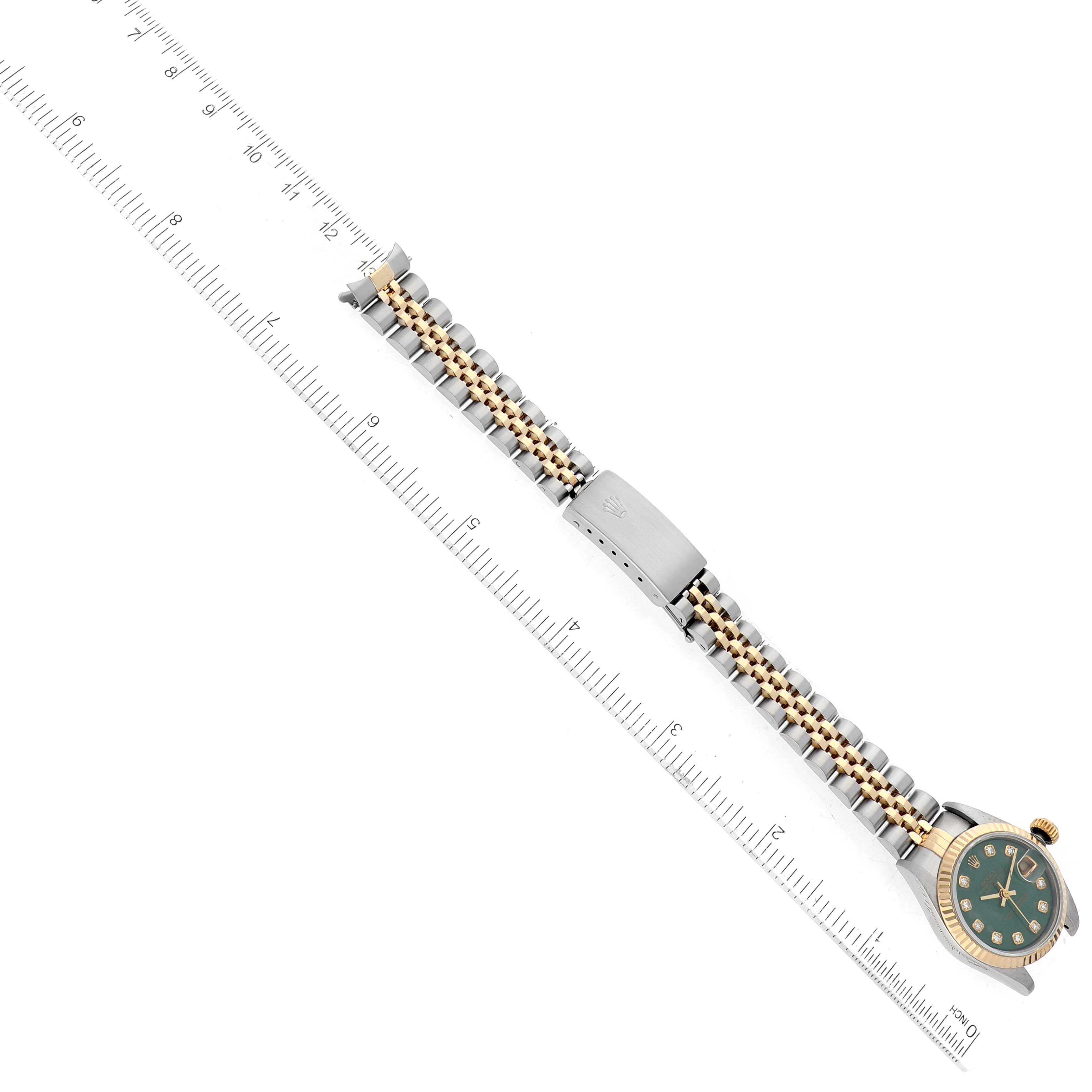 The image shows a Rolex Datejust 69173G Women's Steel and Gold (two tone) Green Dial 69173G Women's Steel and Gold (two tone) Green Dial watch laid flat with its two-tone bracelet displayed next to a ruler for measurement.