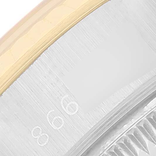 This is a close-up of the bezel and part of the dial of a Rolex Datejust 69173 Women
s Steel and Gold (two tone) Champagne Dial 69173 Women
s Steel and Gold (two tone) Champagne Dial watch.