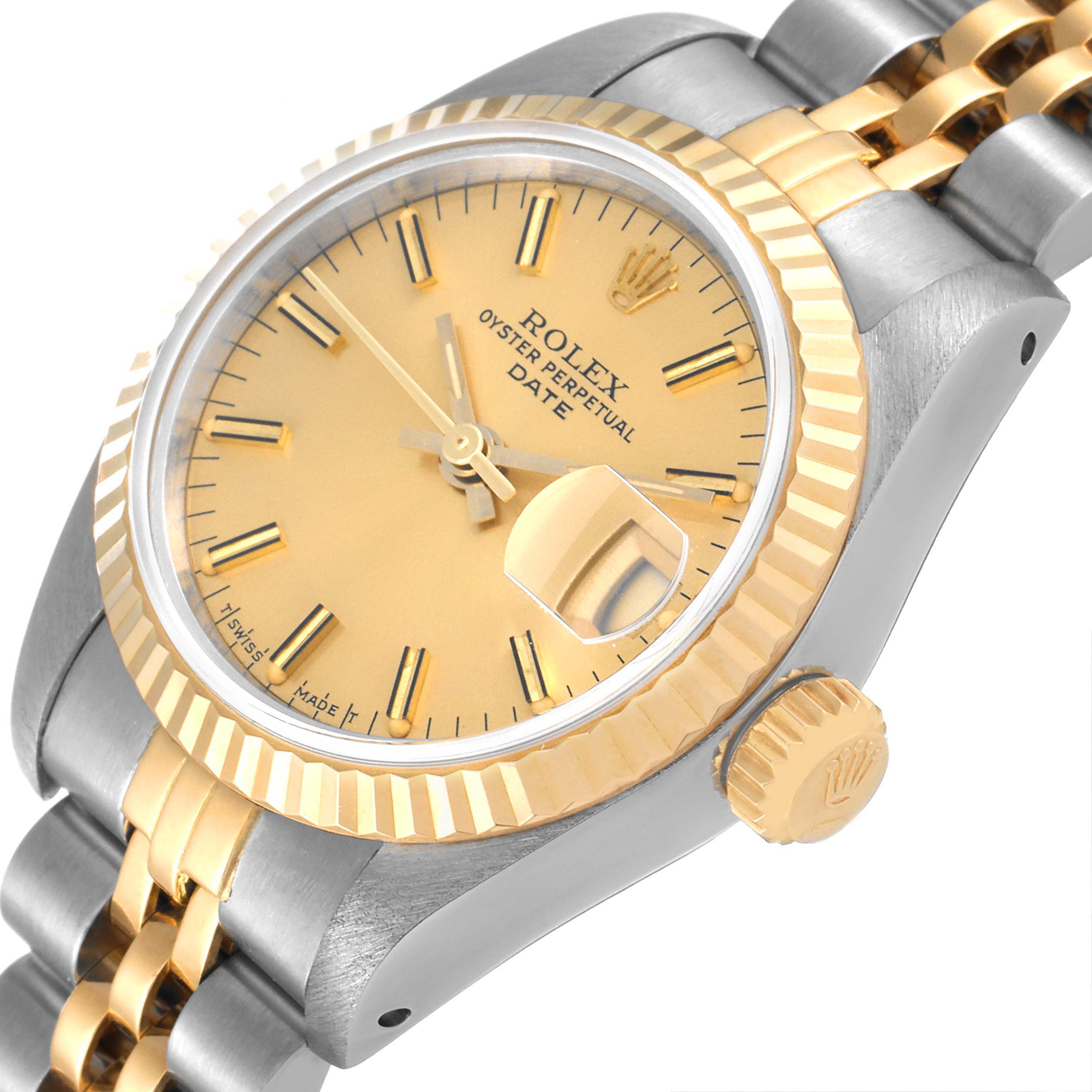 The Rolex Datejust 69173 Women
s Steel and Gold (two tone) Champagne Dial 69173 Women
s Steel and Gold (two tone) Champagne Dial watch is viewed at an angle showcasing the face, crown, bezel, and part of the bracelet.