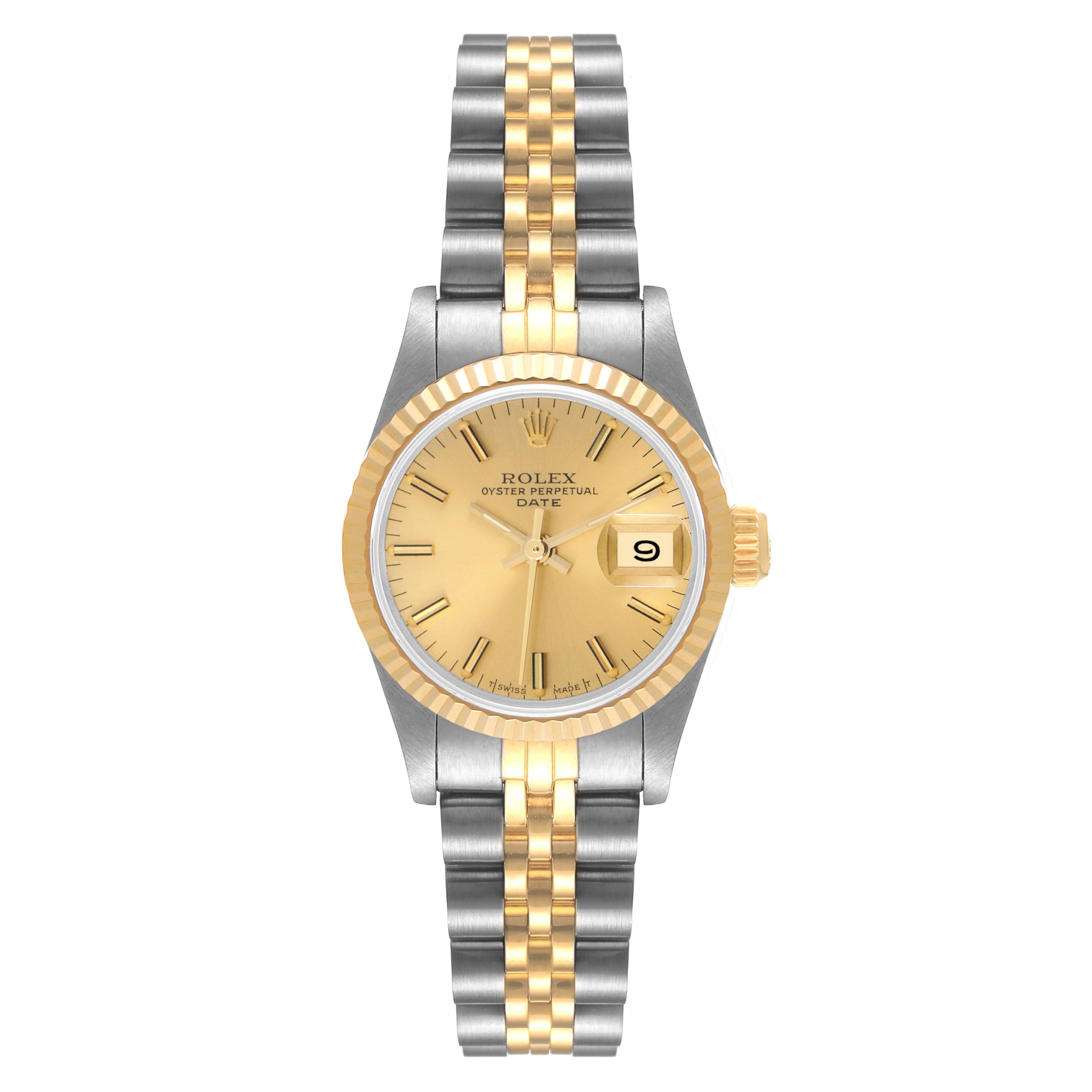 The image shows a frontal view of a Rolex Datejust 69173 Women
s Steel and Gold (two tone) Champagne Dial 69173 Women
s Steel and Gold (two tone) Champagne Dial watch, highlighting its two-tone bracelet, gold fluted bezel, and date display.