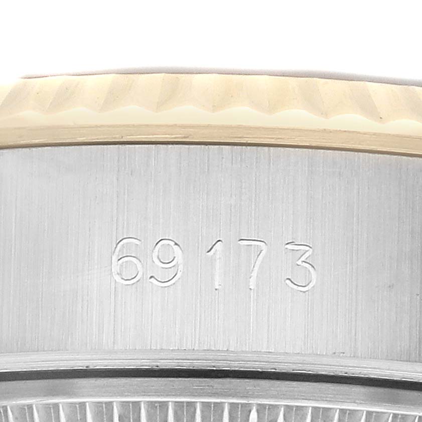 This close-up image shows the side of a Rolex Datejust 69173 Women's Steel and Gold (two tone) Champagne Dial 69173 Women's Steel and Gold (two tone) Champagne Dial watch, featuring the model number "69173."