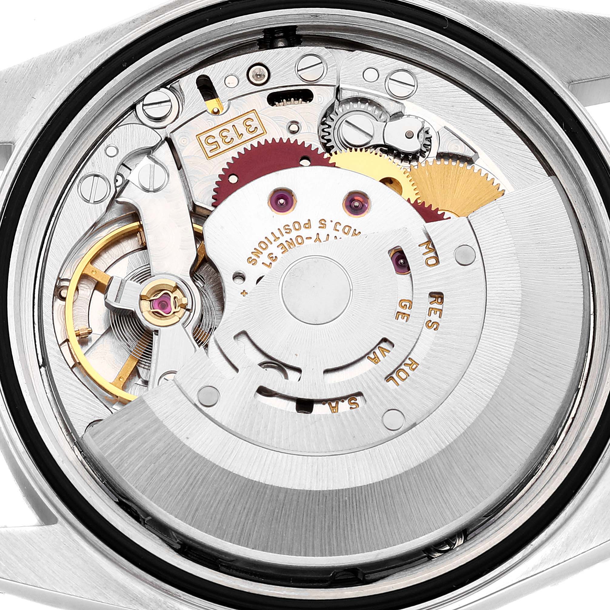This image shows a close-up of the Rolex Datejust 16233 Men's Steel and Gold (two tone) Mother of Pearl Dial 16233 Men's Steel and Gold (two tone) Mother of Pearl Dial movement, highlighting its intricate mechanical components from the back.