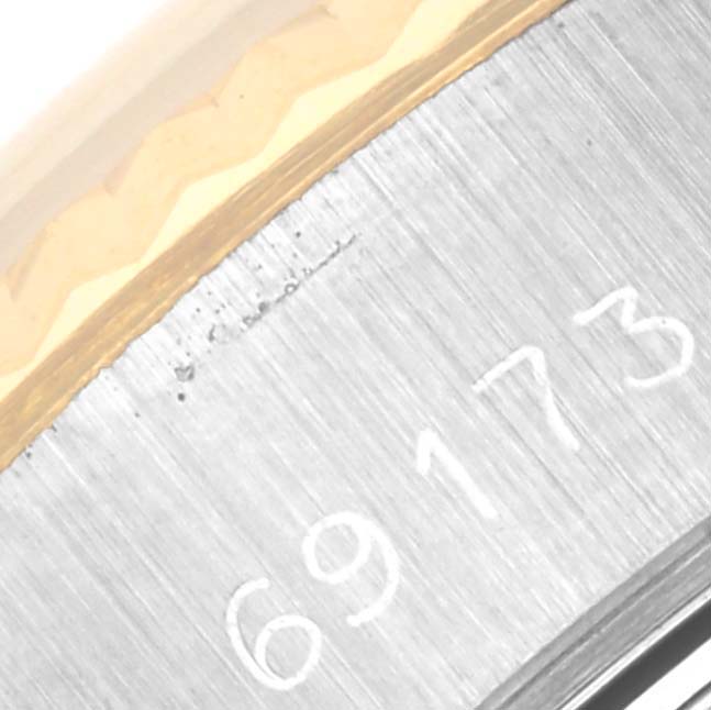 Close-up of the edge and partial reference number '69173' on a Rolex Datejust 69173 Women's Steel and Gold (two tone) White Dial 69173 Women's Steel and Gold (two tone) White Dial watch case.