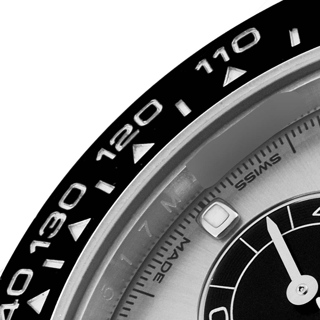 This image shows a close-up of the bezel and part of the dial of a Rolex Daytona 116519 Men's White Gold Silver Dial 116519 Men's White Gold Silver Dial watch.
