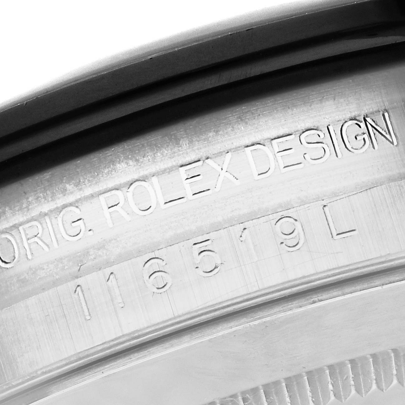 This close-up image shows the inner rim of the case's back of a Rolex Daytona 116519 Men's White Gold Silver Dial 116519 Men's White Gold Silver Dial watch, highlighting the engravings.