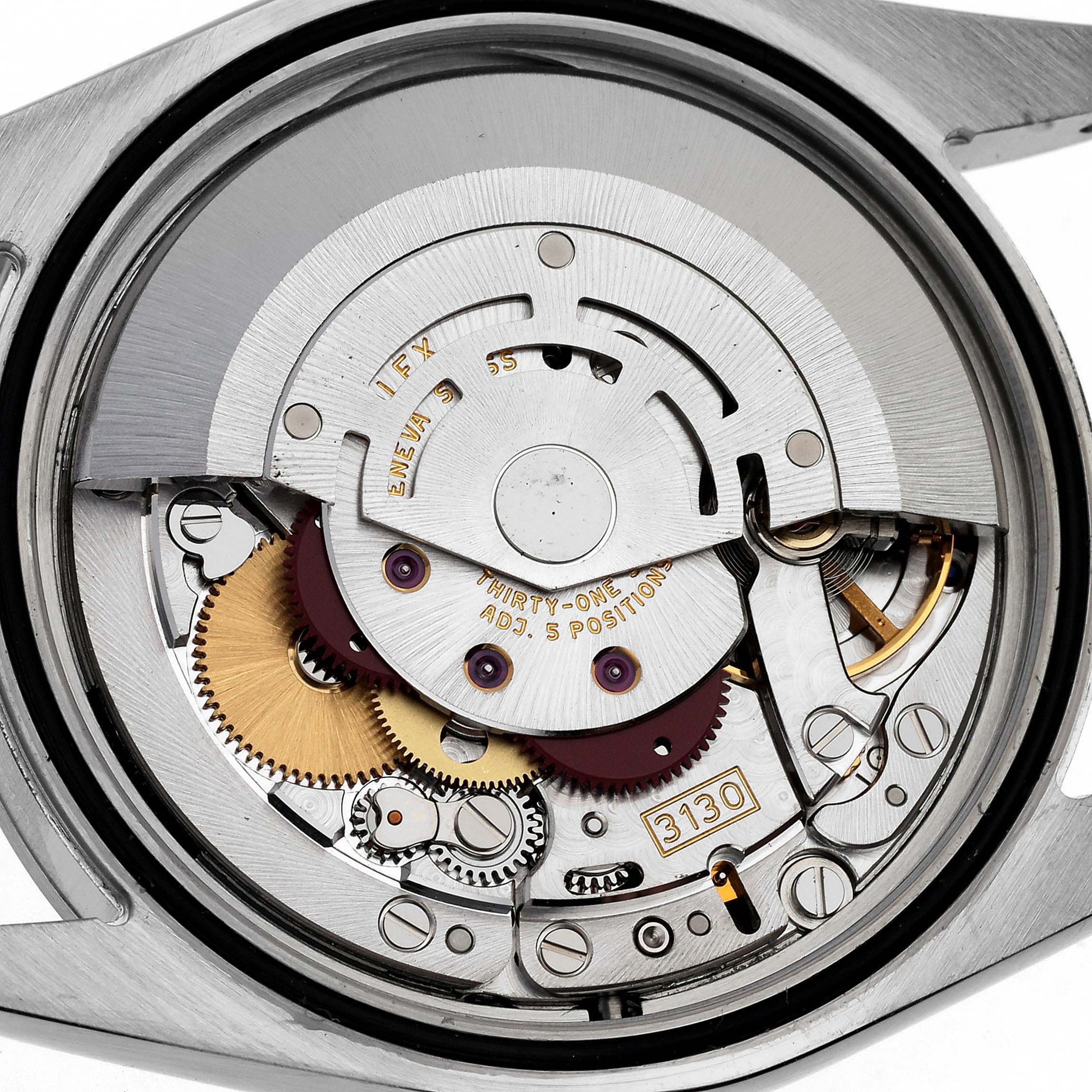 This image shows a close-up of the internal mechanism of a Rolex Explorer 114270 Men
s Stainless Steel Black Dial 114270 Men
s Stainless Steel Black Dial watch, highlighting its gears and intricate components.