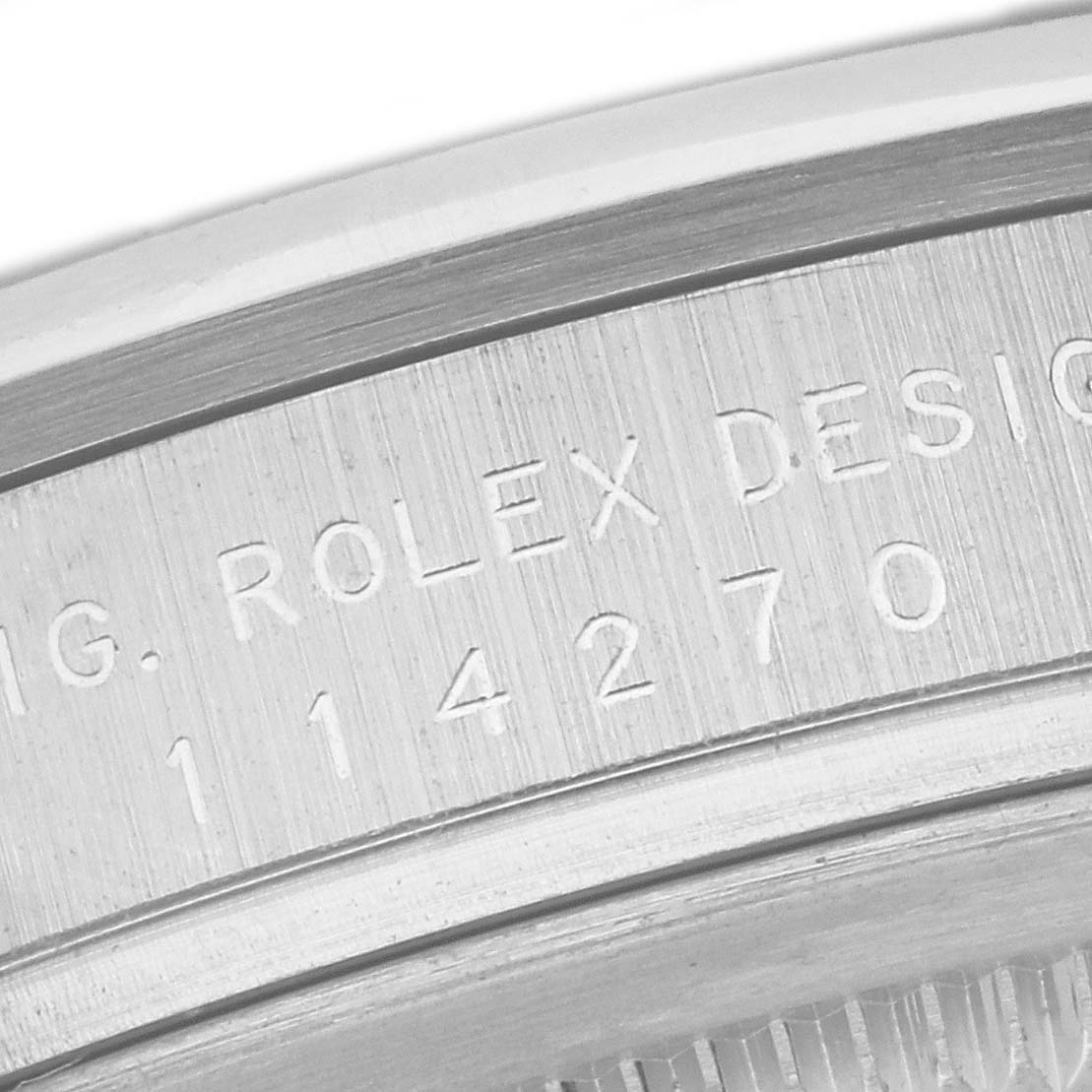 This close-up image shows the outer rim and engraved serial number of the Rolex Explorer 114270 Men
s Stainless Steel Black Dial 114270 Men
s Stainless Steel Black Dial model.