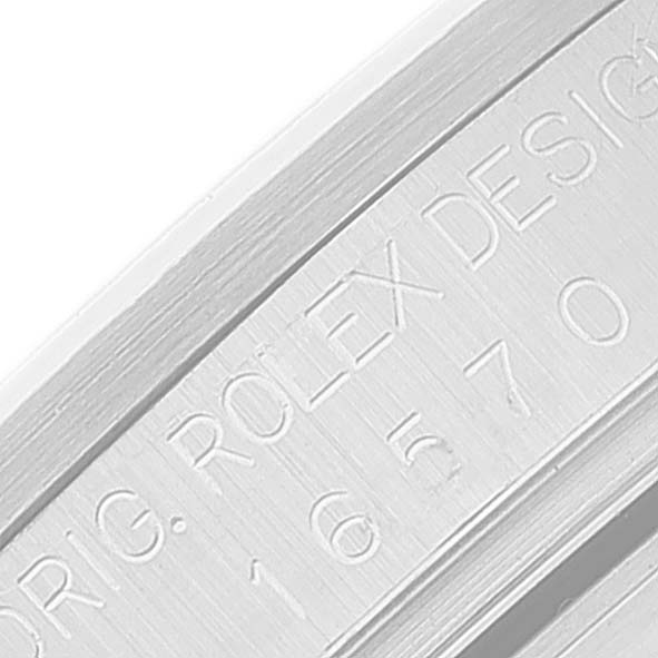 The image shows the etched serial number and branding on the inner bezel of a Rolex Explorer 16570 Men's Stainless Steel Black Dial 16570 Men's Stainless Steel Black Dial watch.