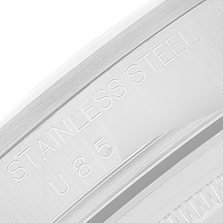 The image shows a close-up of the inner side of the bezel with "STAINLESS STEEL" engraving on a Rolex Explorer 16570 Men's Stainless Steel Black Dial 16570 Men's Stainless Steel Black Dial watch.