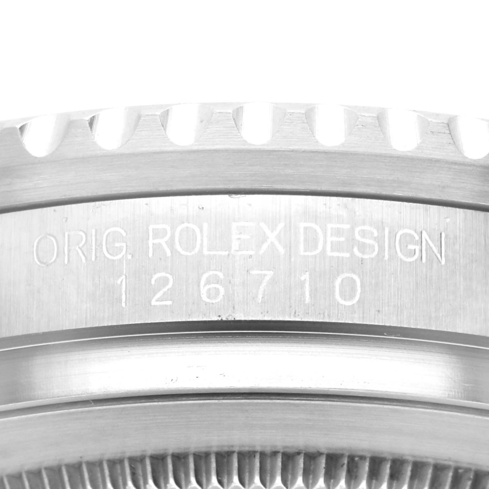 This image shows a close-up of the side of a Rolex GMT-Master 126710BLNR Men
s Stainless Steel Black Dial 126710BLNR Men
s Stainless Steel Black Dial case, highlighting the engraved model number 126710.
