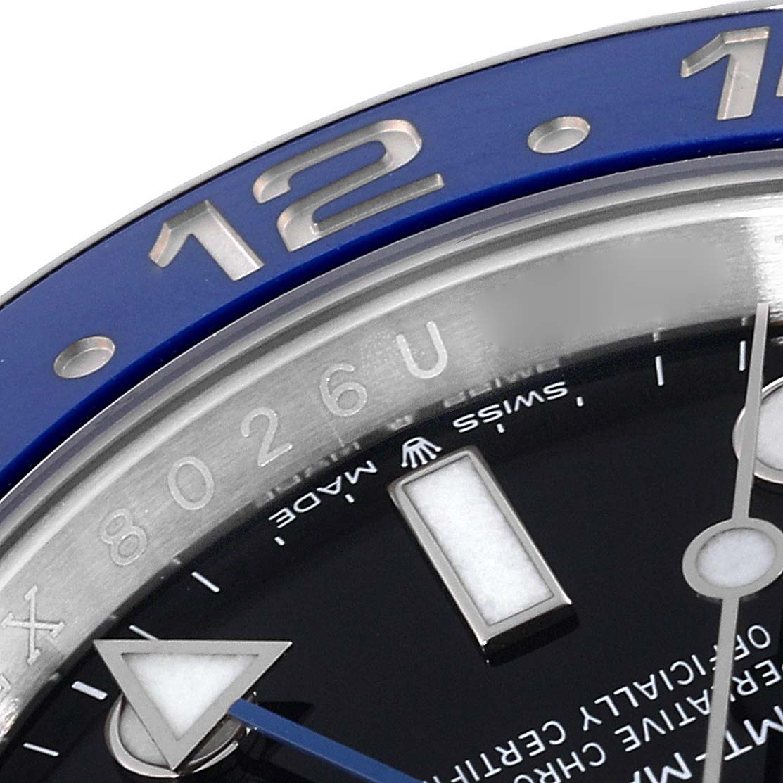This image shows a close-up of the blue bezel, part of the dial, and the hour markers of a Rolex GMT-Master 126710BLNR Men
s Stainless Steel Black Dial 126710BLNR Men
s Stainless Steel Black Dial watch.