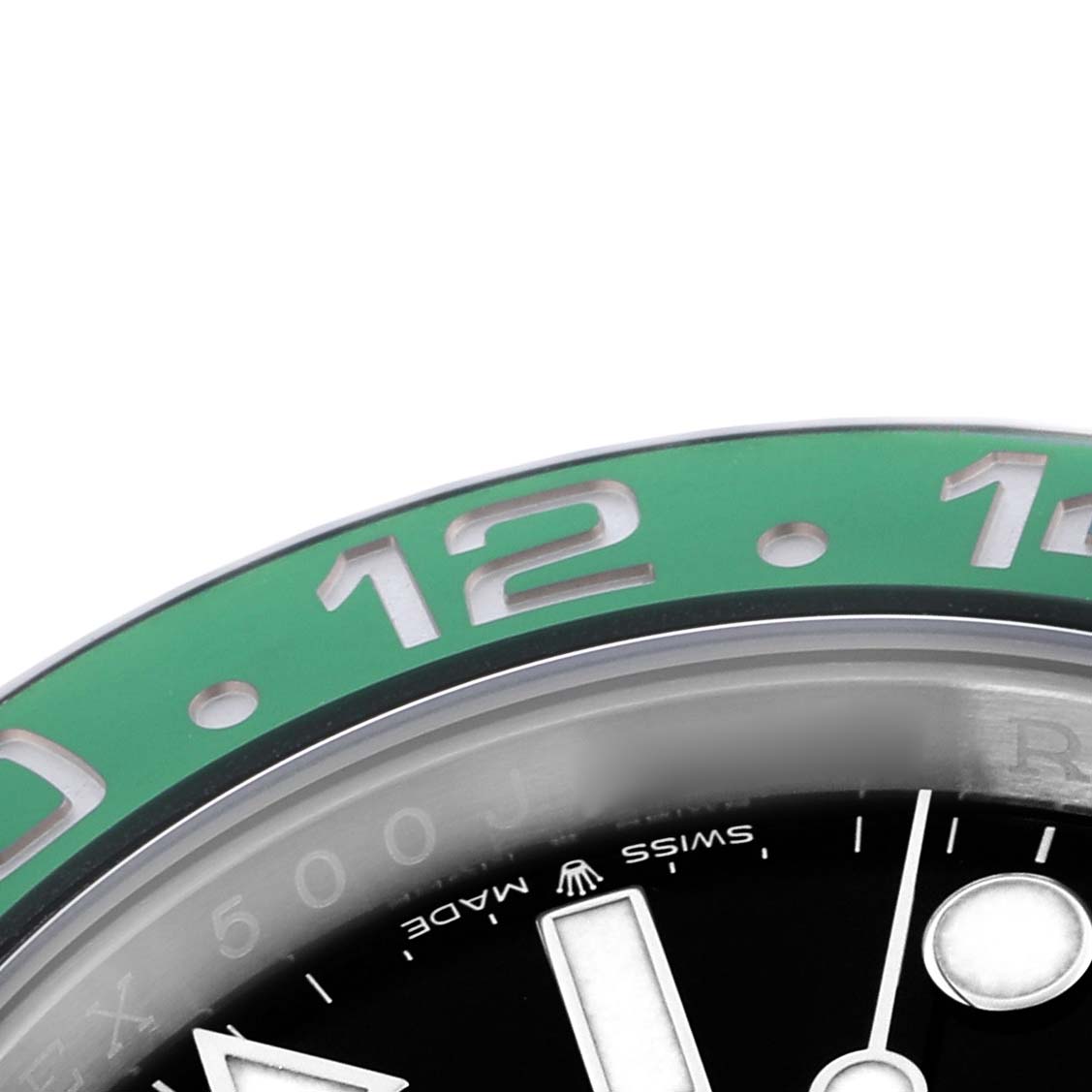The image shows a close-up of the Rolex GMT-Master 126720VTNR Men
s Stainless Steel Black Dial 126720VTNR Men
s Stainless Steel Black Dial watch, focusing on the bezel with the "12" marker and part of the dial.