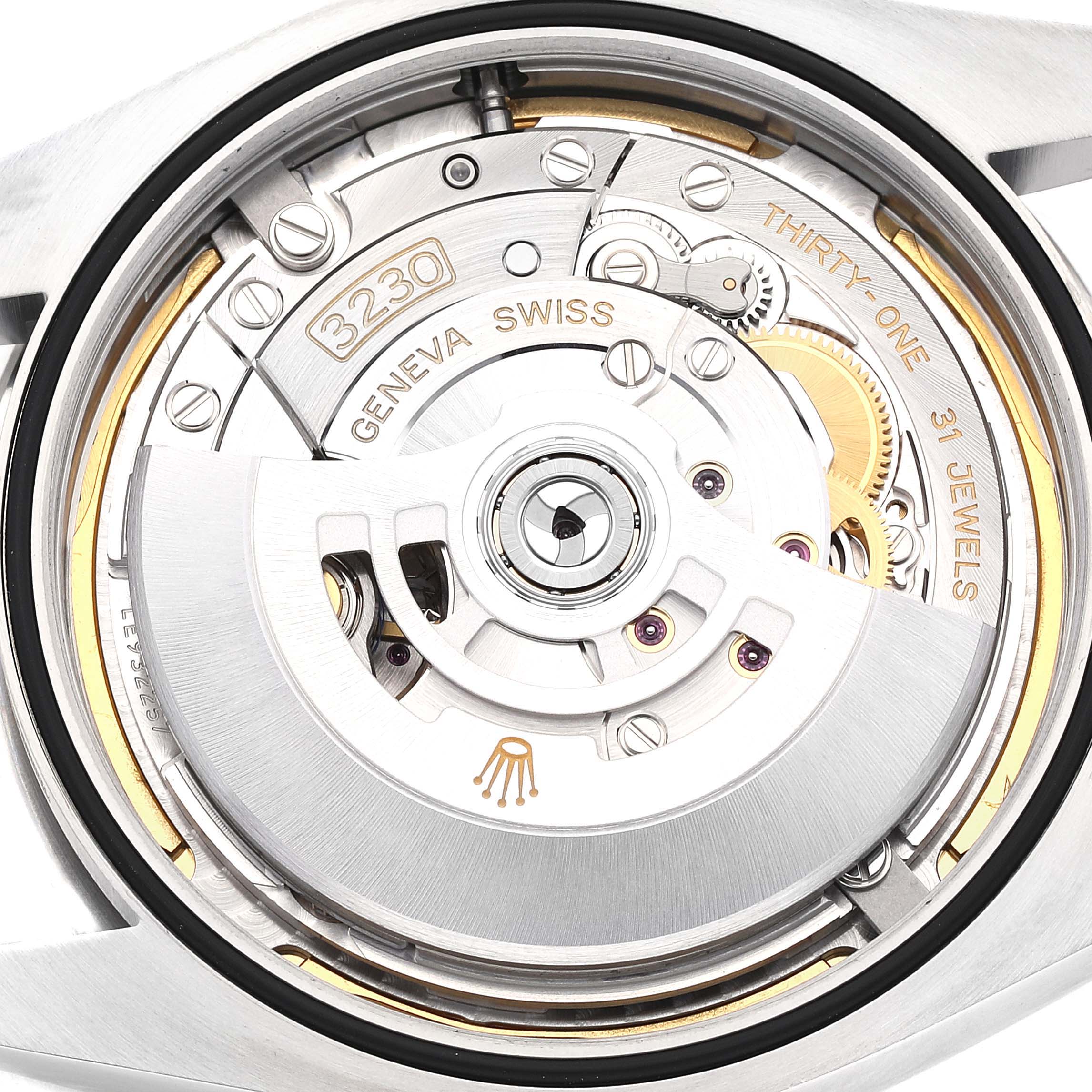 This image shows a close-up of the movement mechanism of the Rolex Oyster Perpetual 124300 Men's Stainless Steel Blue Dial 124300 Men's Stainless Steel Blue Dial watch, highlighting gears, jewels, and engravings.