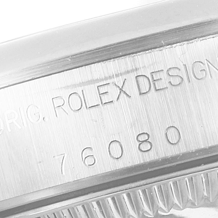 The image shows a close-up of the side of the watch casing of an Oyster Perpetual model by Rolex, highlighting the engraved model number.
