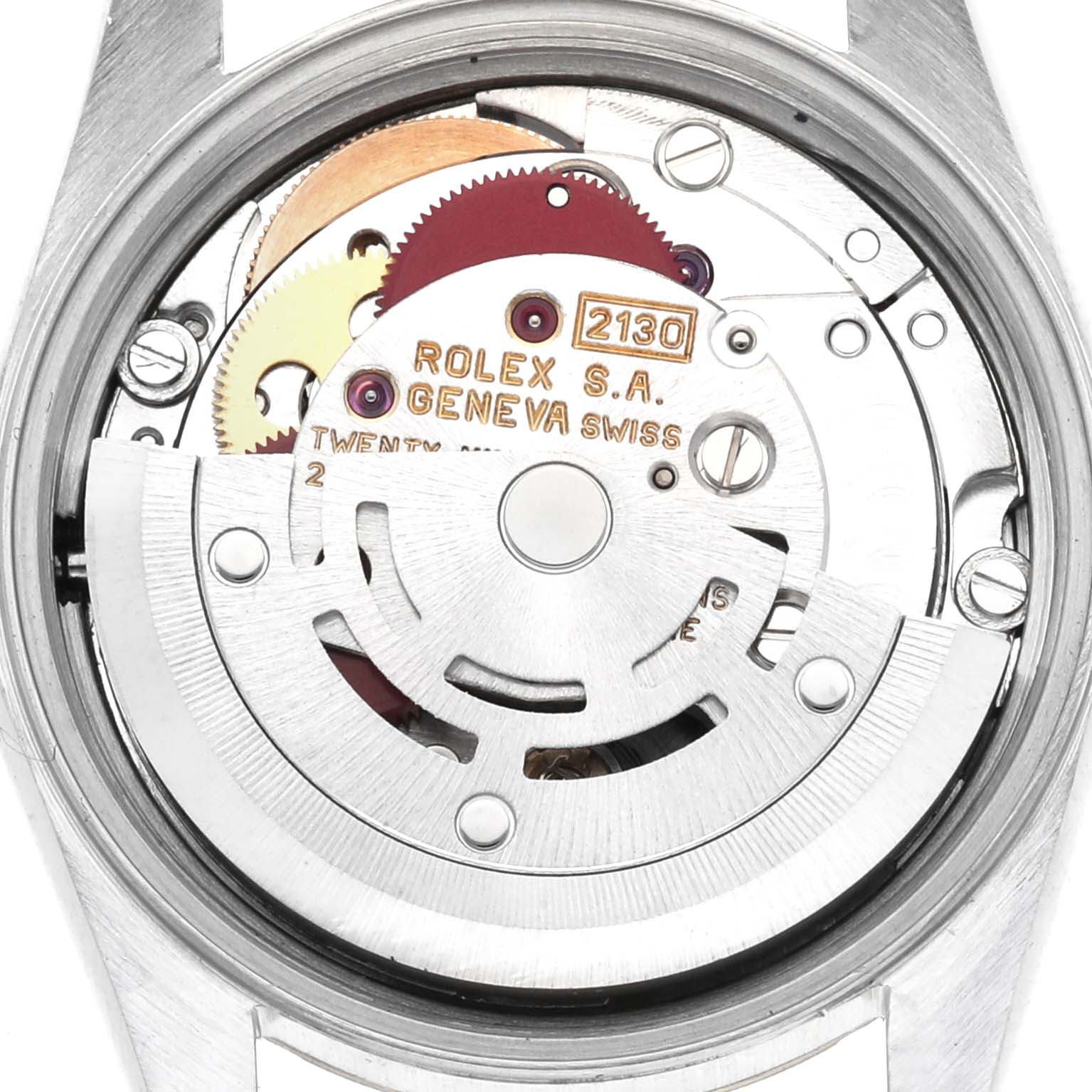 The image shows the internal mechanism of the Oyster Perpetual by Rolex from a rear angle, focusing on the movement components.