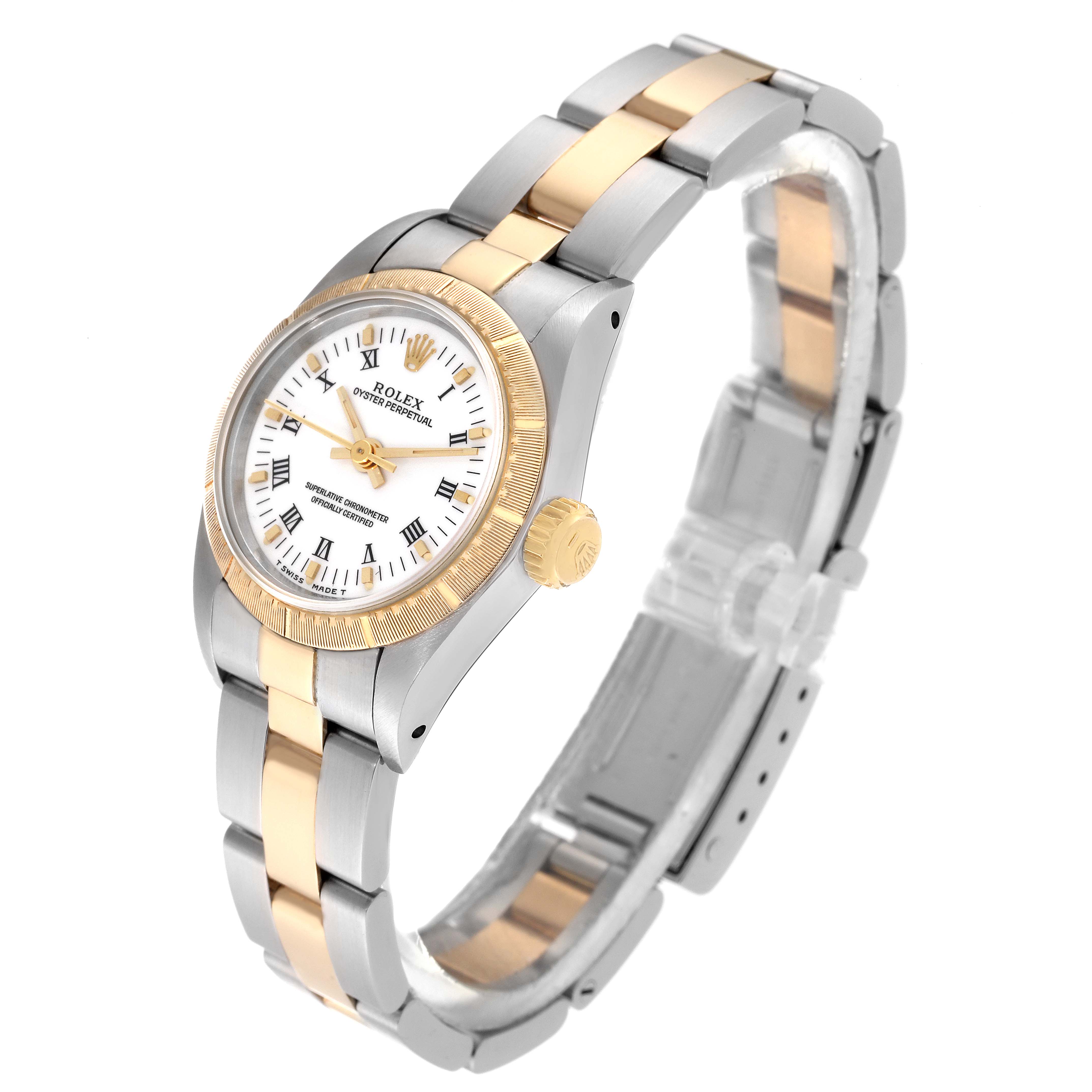 The Rolex Oyster Perpetual 67243 Women
s Steel and Gold (two tone) White Dial 67243 Women
s Steel and Gold (two tone) White Dial watch is shown at a slight angle, displaying its face, bezel, and two-tone bracelet.
