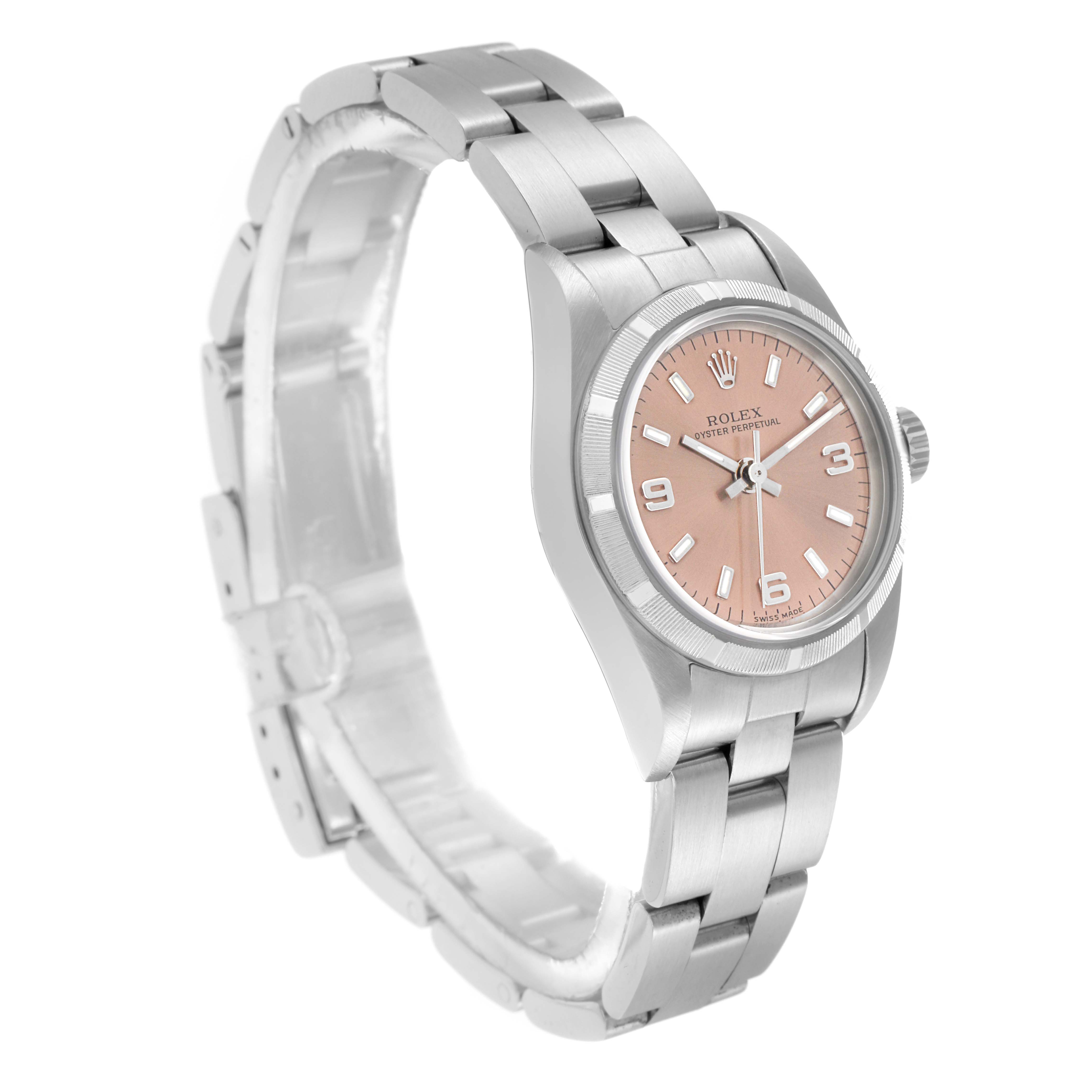 The Rolex Oyster Perpetual 76030 Women's Stainless Steel Pink Dial 76030 Women's Stainless Steel Pink Dial watch is shown at a three-quarter view, displaying the pink face, bezel, crown, and bracelet.