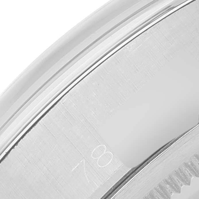 This is a close-up view of the case edge and bezel of a Vintage Collection Rolex watch.