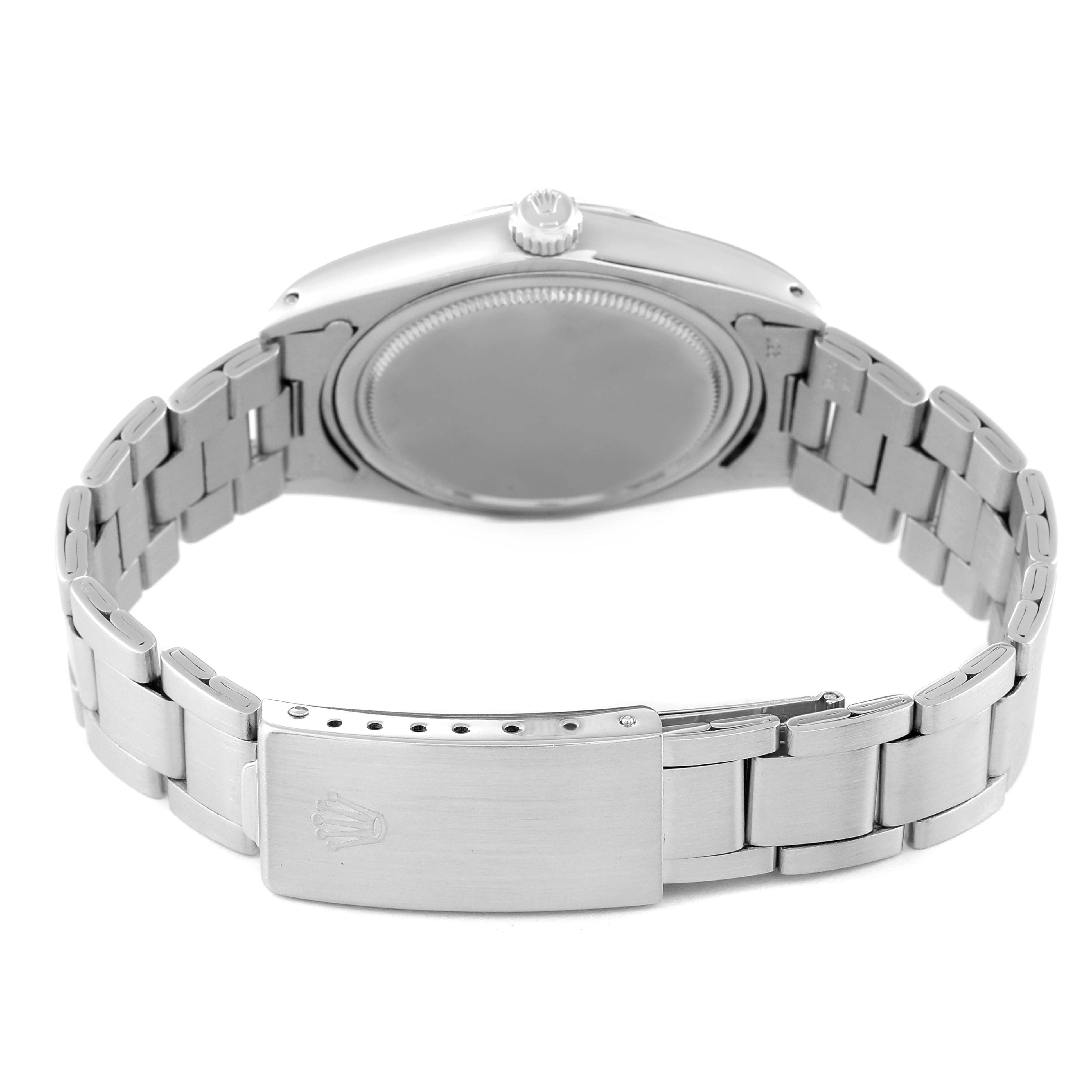 This image shows a Rolex Vintage Collection 6694 Men
s Stainless Steel Silver Dial 6694 Men
s Stainless Steel Silver Dial watch from the back, highlighting the closed clasp and the bracelet.