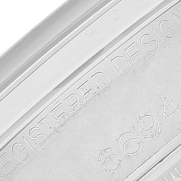 The image shows a close-up of the side of the Vintage Collection watch by Rolex with the engraved design registration.