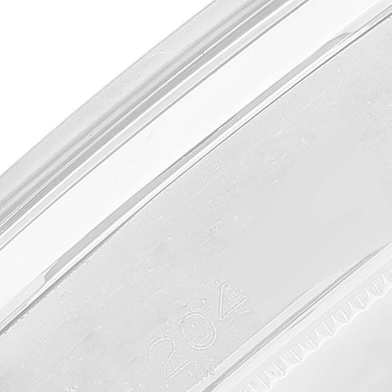 This image shows a close-up of the back case of the Rolex Vintage Collection 6694 Men
s Stainless Steel Silver Dial 6694 Men
s Stainless Steel Silver Dial model, focusing on its engravings and ridges.