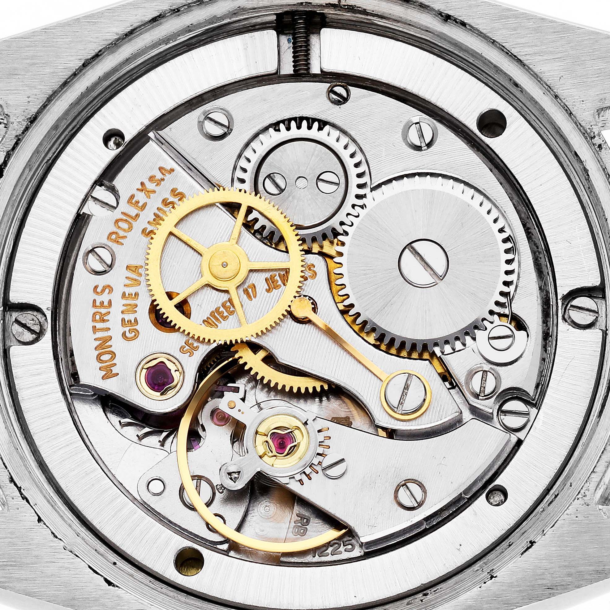 The image shows the inner mechanics of the Rolex Vintage Collection 6694 Men
s Stainless Steel Silver Dial 6694 Men
s Stainless Steel Silver Dial watch, featuring gears and cogs from a top-down angle.