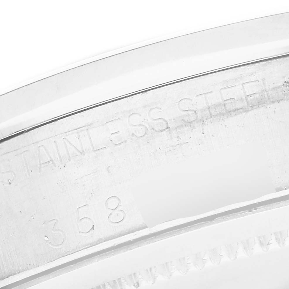The image shows a close-up of the engraved case back edge of a Rolex Vintage Collection 6694 Men
s Stainless Steel Silver Dial 6694 Men
s Stainless Steel Silver Dial watch.