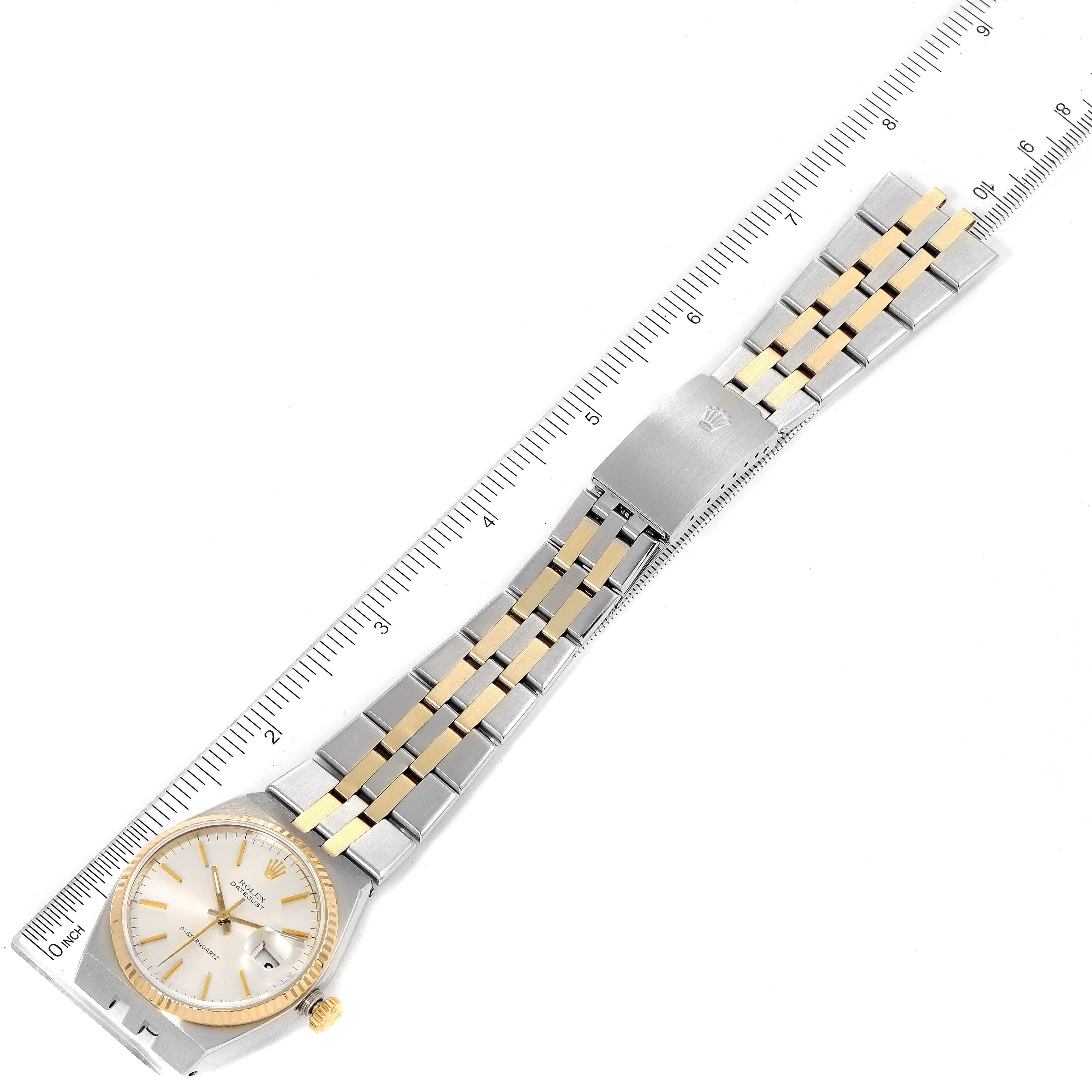 This image shows the top view of a Rolex Oysterquartz 17013 Men's Steel and Gold (two tone) Silver Dial 17013 Men's Steel and Gold (two tone) Silver Dial watch, featuring the band, face, and clasp.