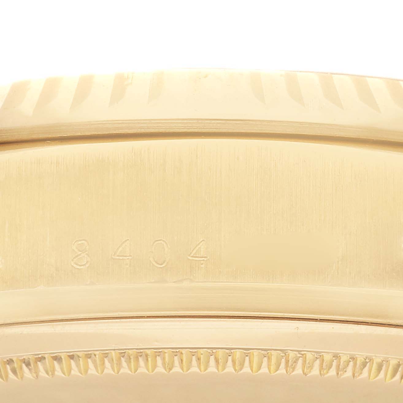 This close-up image shows the serial number and edge details of a Rolex President 18038 Men
s Yellow Gold Black Dial 18038 Men
s Yellow Gold Black Dial model watch.