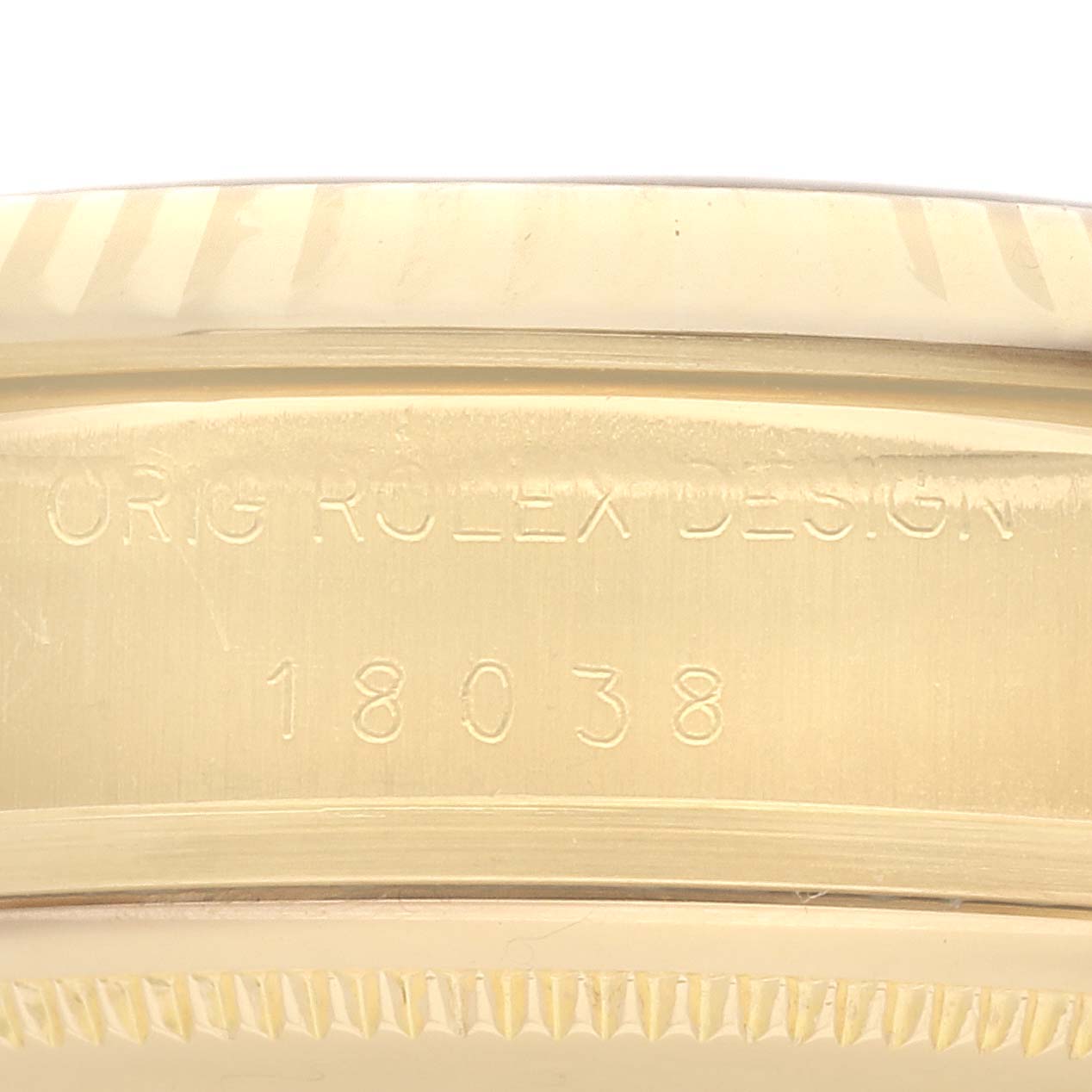 This image shows a close-up of the side of a Rolex President 18038 Men
s Yellow Gold Black Dial 18038 Men
s Yellow Gold Black Dial model, displaying its engraved model number.