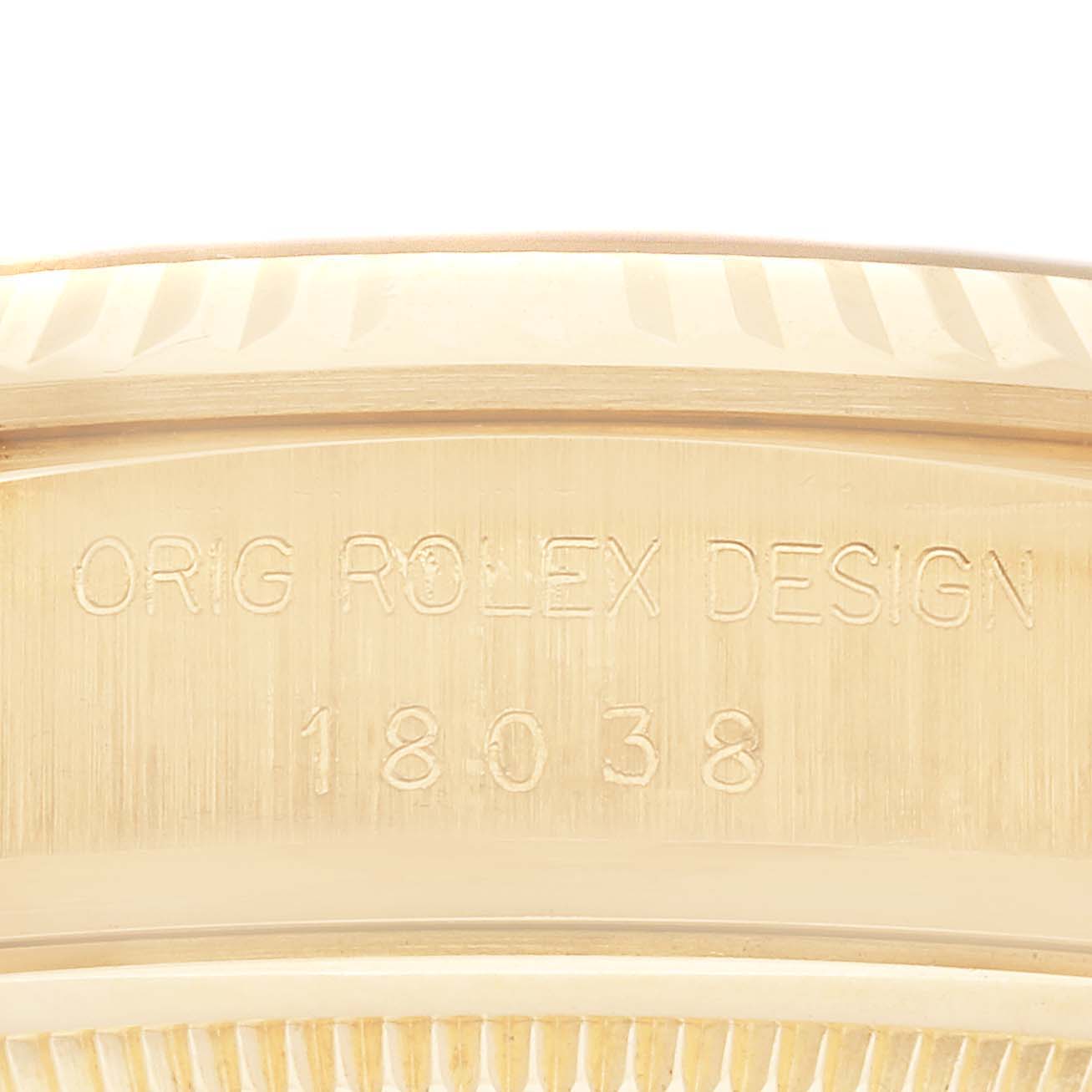 The image shows a close-up of the case-back engraving on a Rolex President 18038 Men
s Yellow Gold Champagne Dial 18038 Men
s Yellow Gold Champagne Dial model, displaying "ORIG ROLEX DESIGN" and the number "18038."