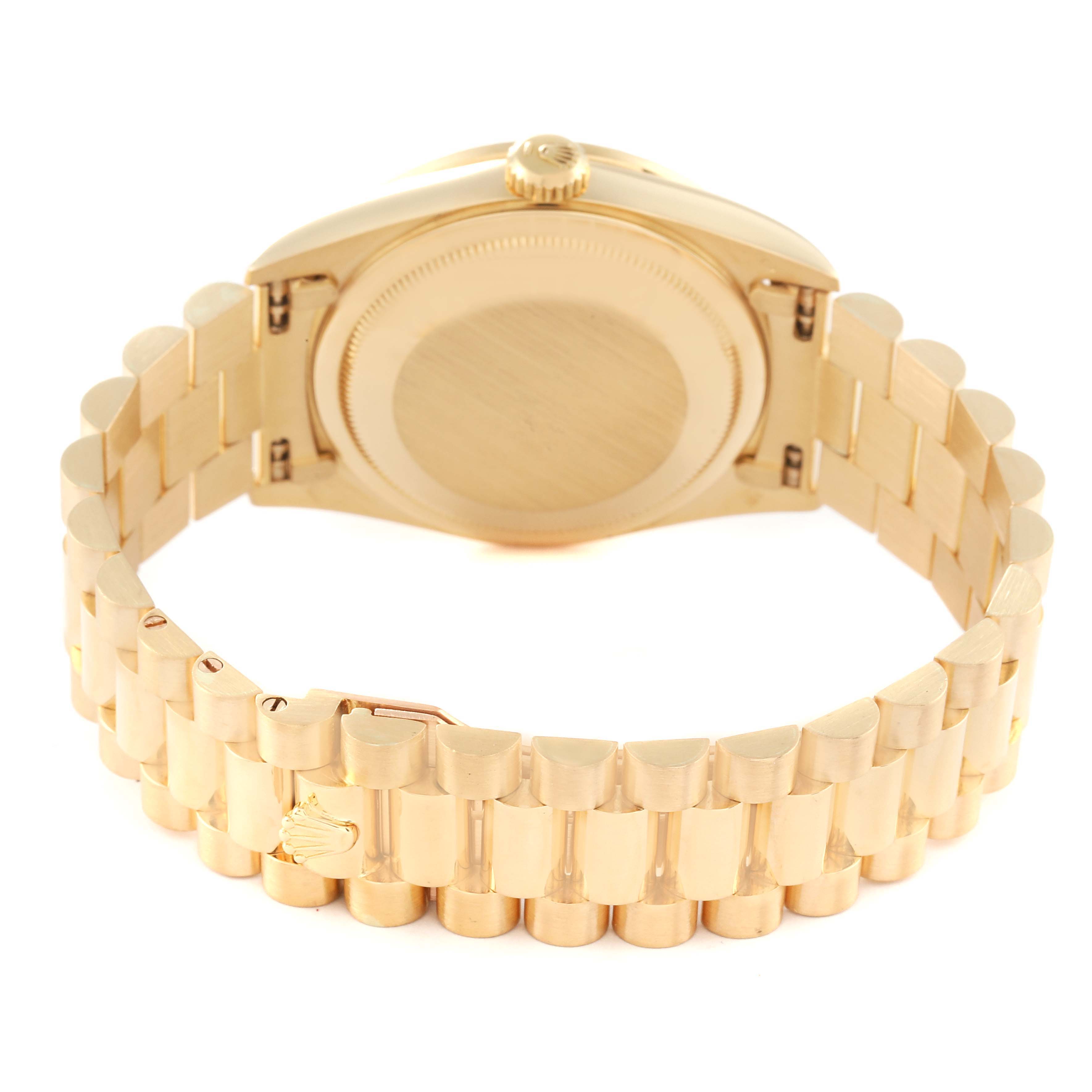 The image shows the back and bracelet of a Rolex President 18388 Men
s Yellow Gold Champagne Dial 18388 Men
s Yellow Gold Champagne Dial model watch in a close-up angle.