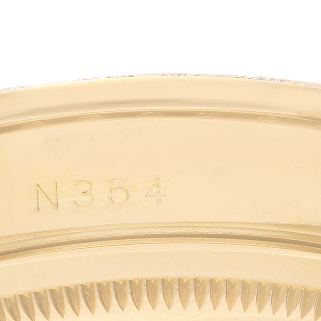 This image shows a close-up of the engraved case back or bezel of the Rolex President 18388 Men
s Yellow Gold Champagne Dial 18388 Men
s Yellow Gold Champagne Dial model watch.