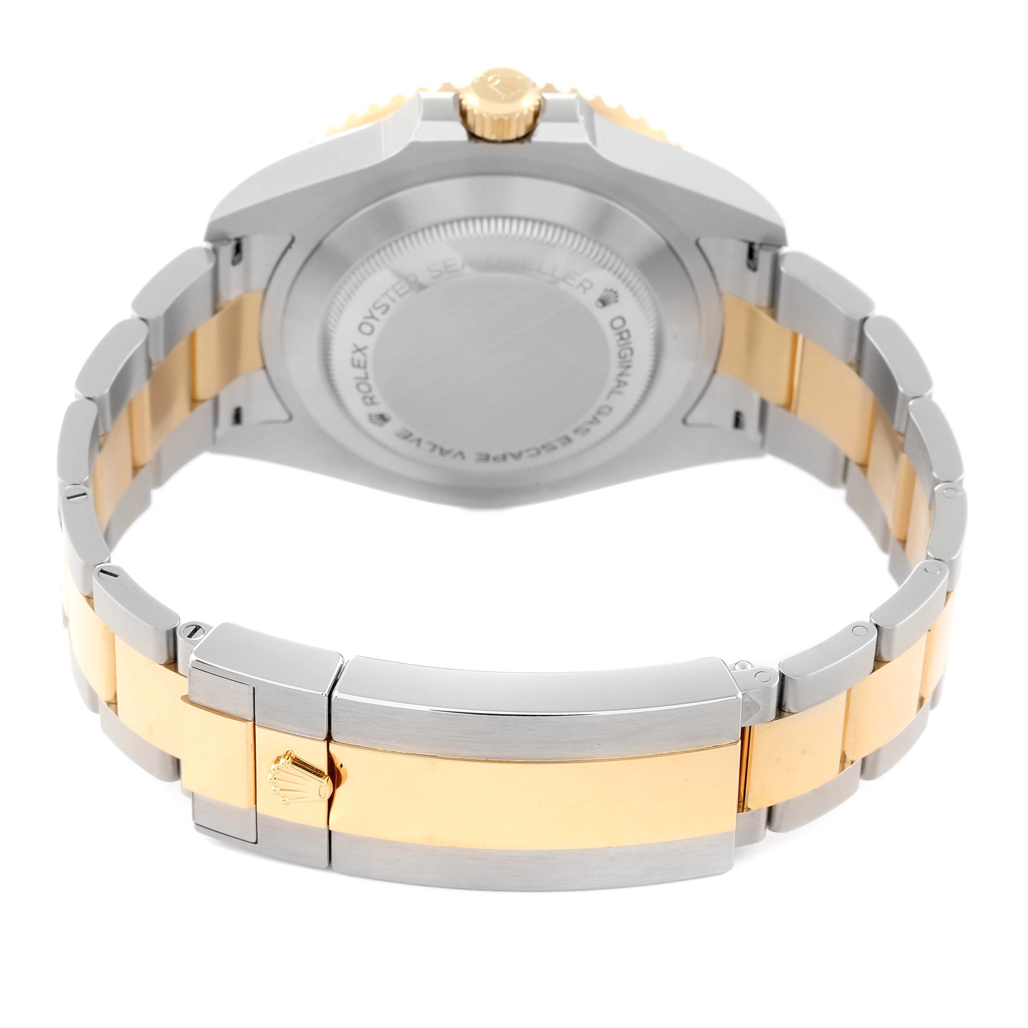 The image shows the back view of a Rolex Sea-Dweller 126603 Men's Steel and Gold (two tone) Black Dial 126603 Men's Steel and Gold (two tone) Black Dial with focus on the case back, crown, and two-tone bracelet with clasp.