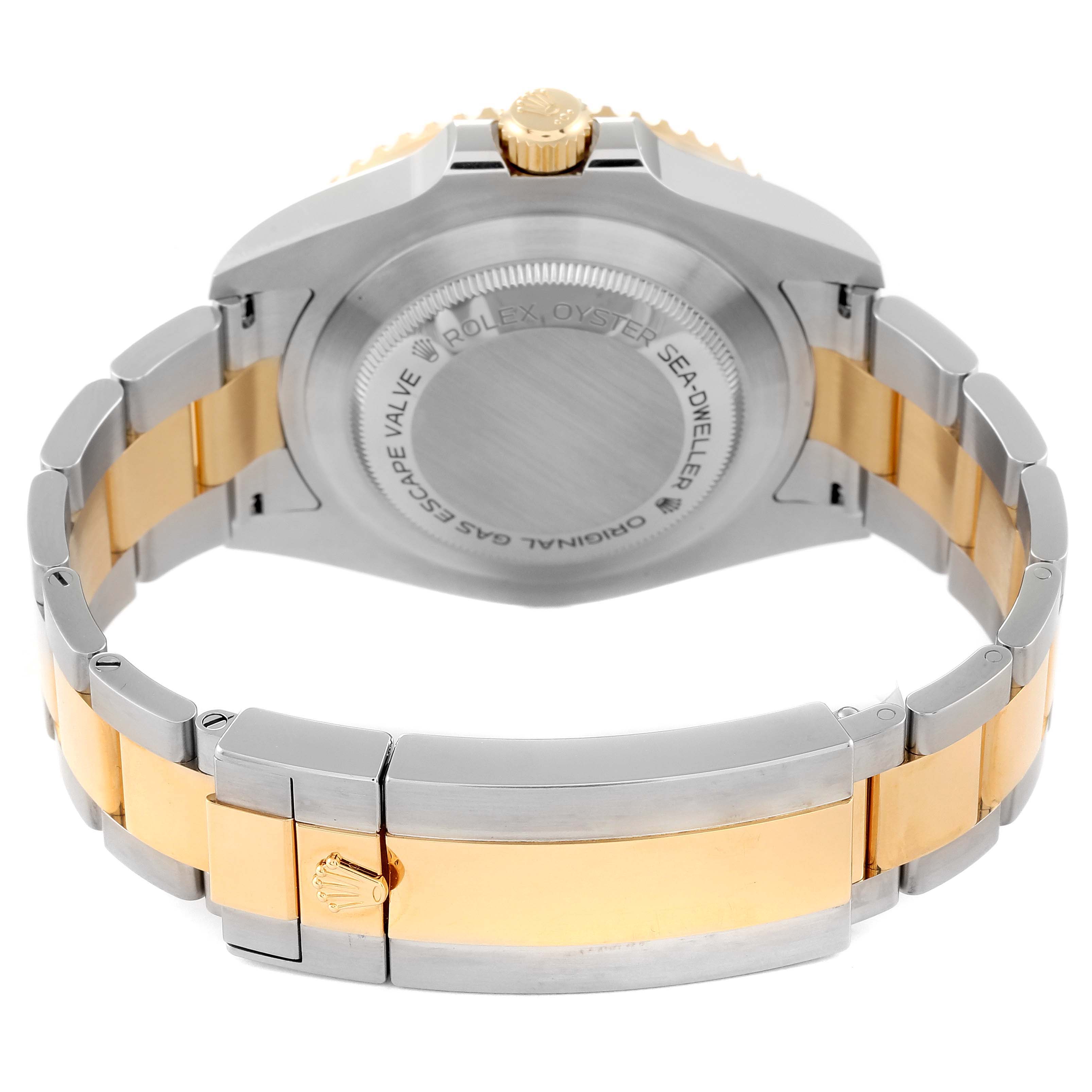 The image shows the back view of a Rolex Sea-Dweller 126603 Men
s Steel and Gold (two tone) Black Dial 126603 Men
s Steel and Gold (two tone) Black Dial watch, highlighting its case back, crown, and the two-tone metal bracelet.