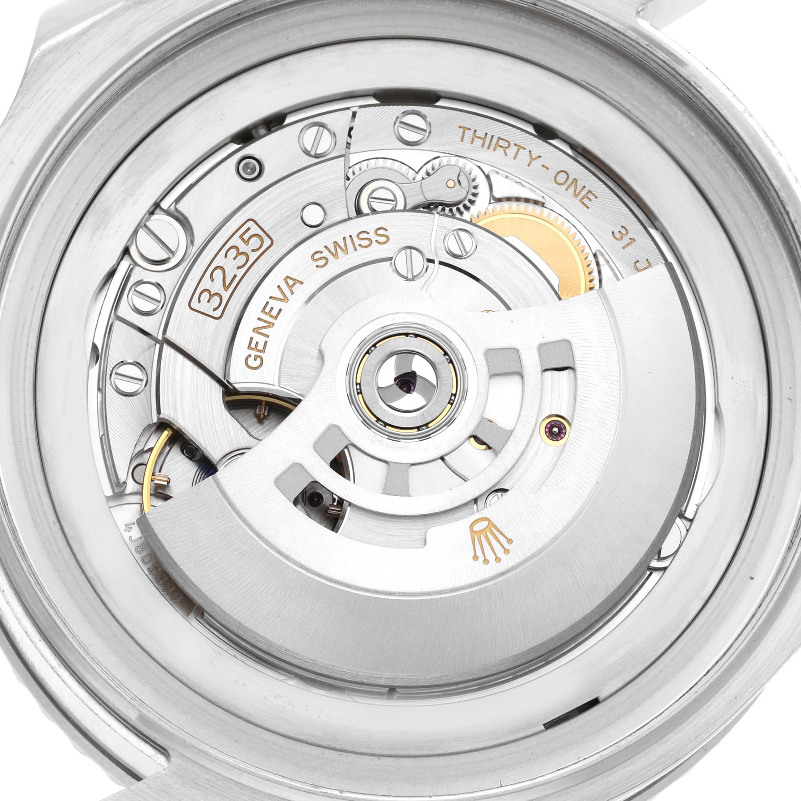 The image shows a close-up view of the movement inside a Rolex Sea-Dweller 126660 Men's Stainless Steel Blue Dial 126660 Men's Stainless Steel Blue Dial watch, specifically its intricate mechanical components.