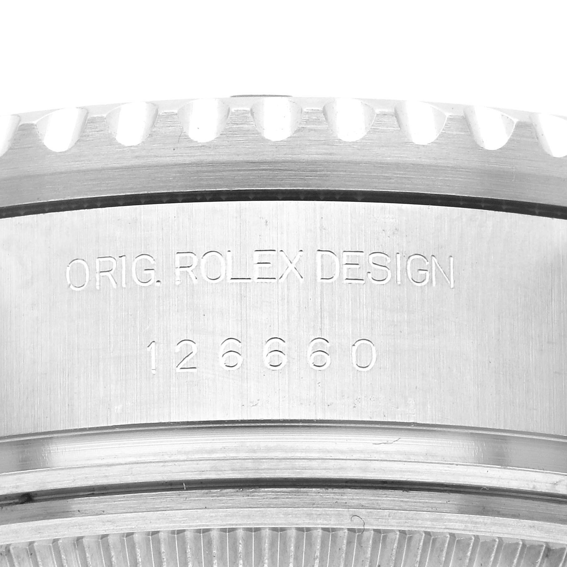 This close-up image shows the engraved side of a Rolex Sea-Dweller 126660 Men's Stainless Steel Blue Dial 126660 Men's Stainless Steel Blue Dial watch, highlighting the brand marking and model number 126660.