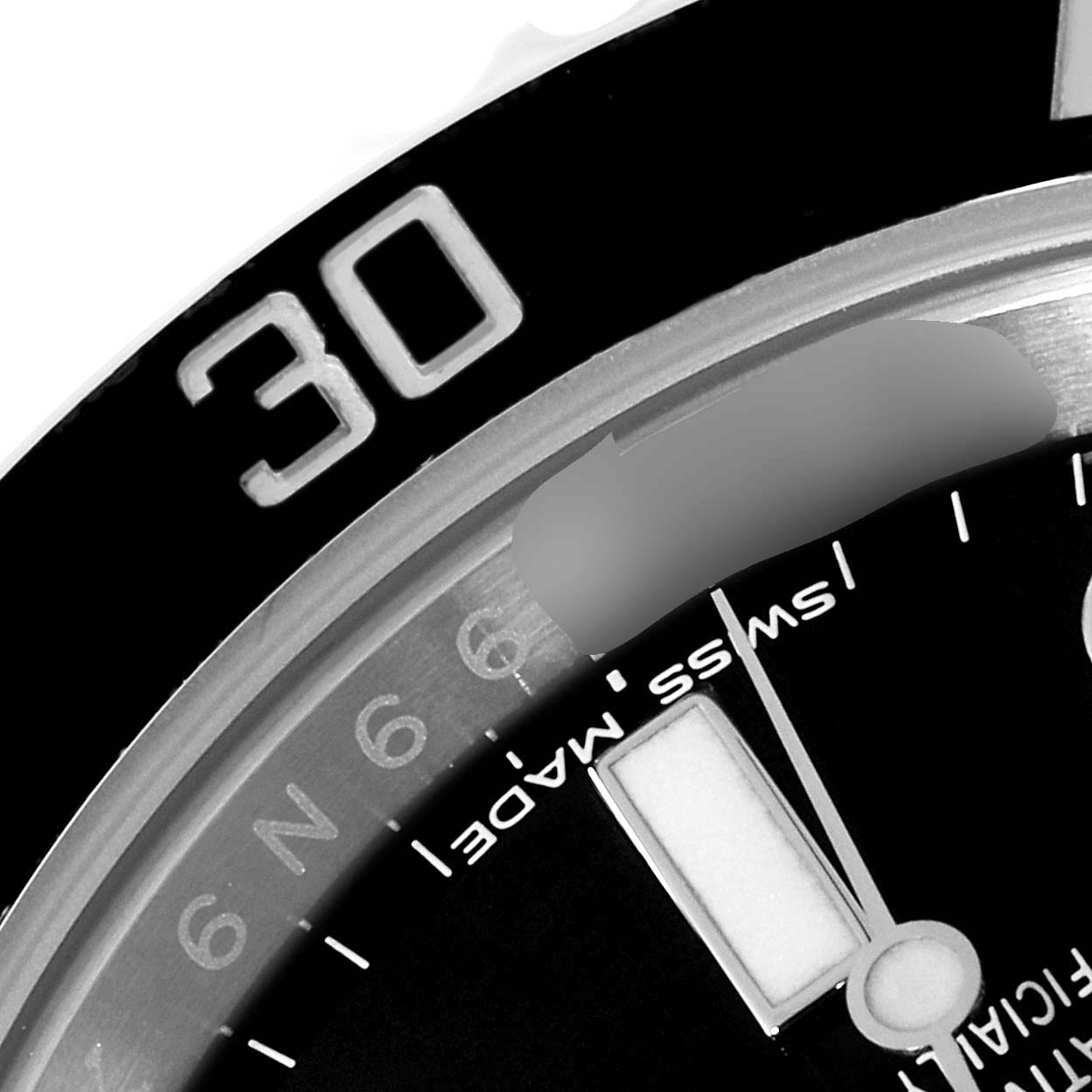 This image shows a close-up of the dial and the 30-minute marker on the bezel of a Rolex Submariner 114060 Men
s Stainless Steel Black Dial 114060 Men
s Stainless Steel Black Dial watch.