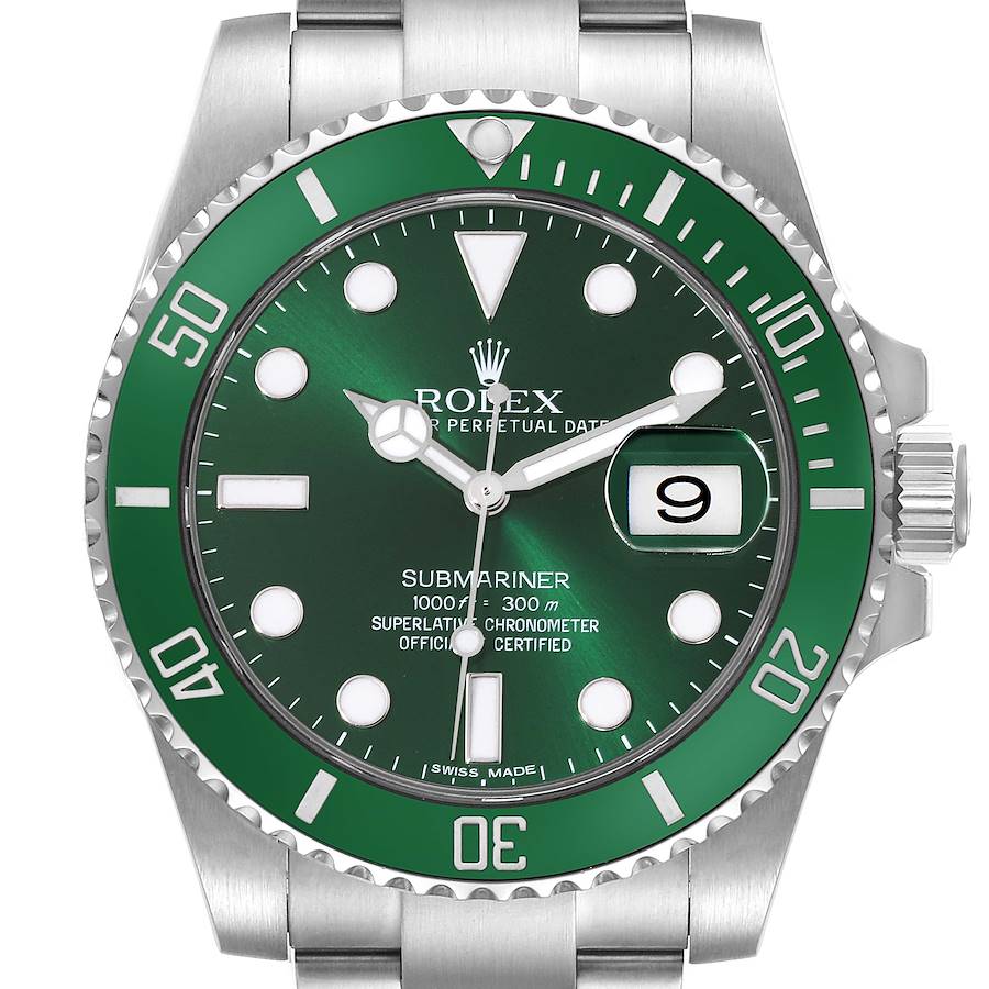 The image shows the front view of a Rolex Submariner watch, displaying its green dial and bezel, silver bracelet, and crown.