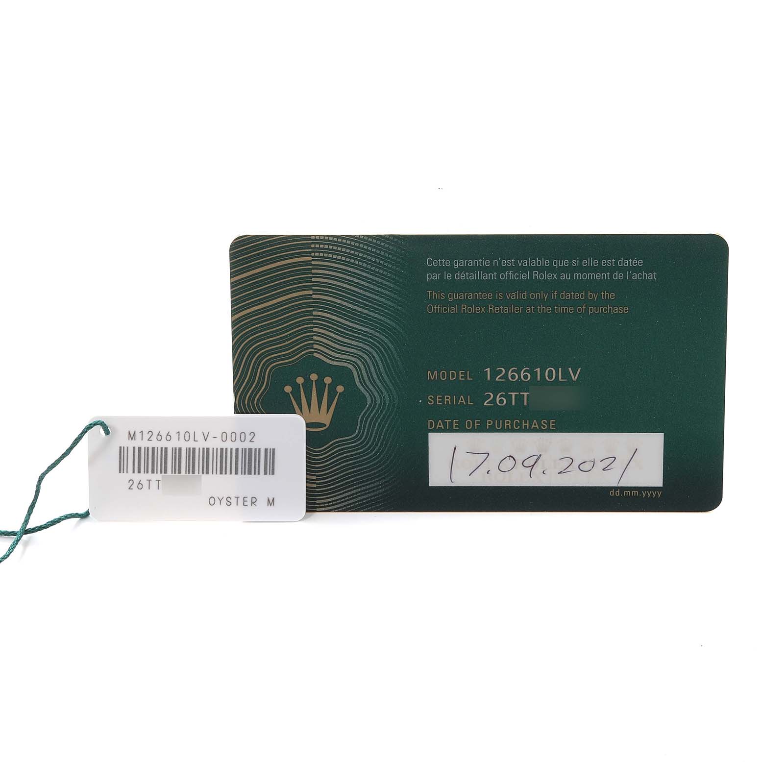 The image shows a Rolex Submariner 126610LV Men
s Stainless Steel Black Dial 126610LV Men
s Stainless Steel Black Dial warranty card and a green tag with the model number 126610LV.