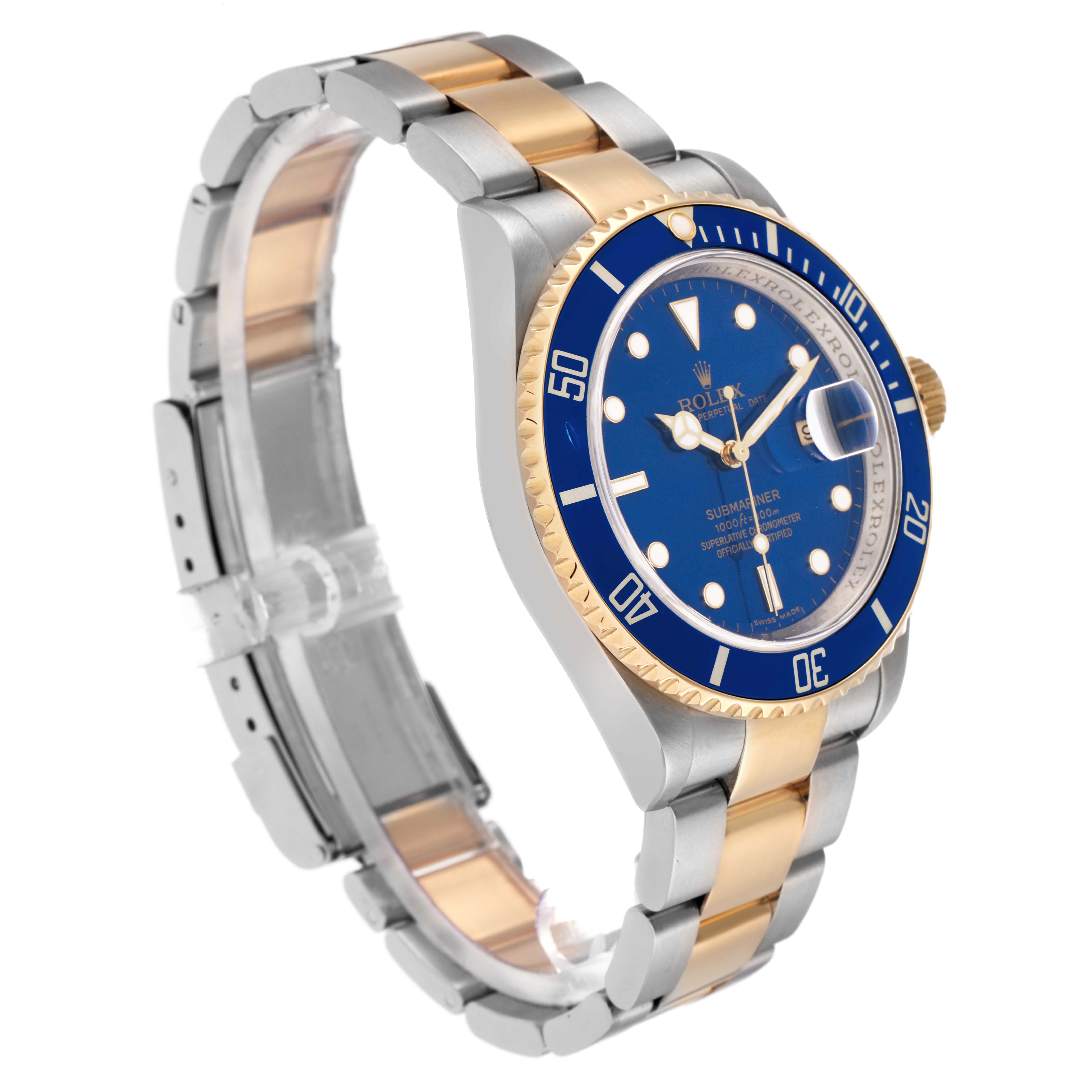 The Rolex Submariner 16613 Men
s Steel and Gold (two tone) Blue Dial 16613 Men
s Steel and Gold (two tone) Blue Dial watch is shown at a three-quarter angle, highlighting the blue dial, two-tone bracelet, and rotating bezel.